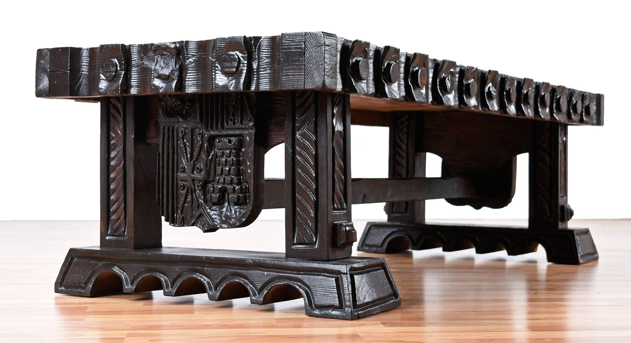 Polynesian inspired ornately carved tiki coffee table possibly made by a Witco employee who worked in the 1960s under William Westenhaver. The deep carvings along the top of the coffee table are filled with amber resin and has a crackle texture to