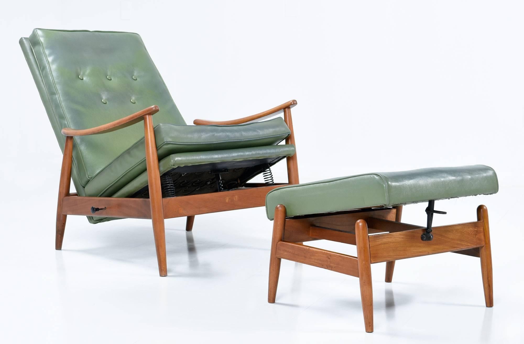Early Milo Baughman Mid-Century Modern recliner for James Inc. All original! This is a true recliner with manual control on the side to regulate the chair position. Ottoman can also incline or lie flat. Green vinyl upholstery is original. James Inc.