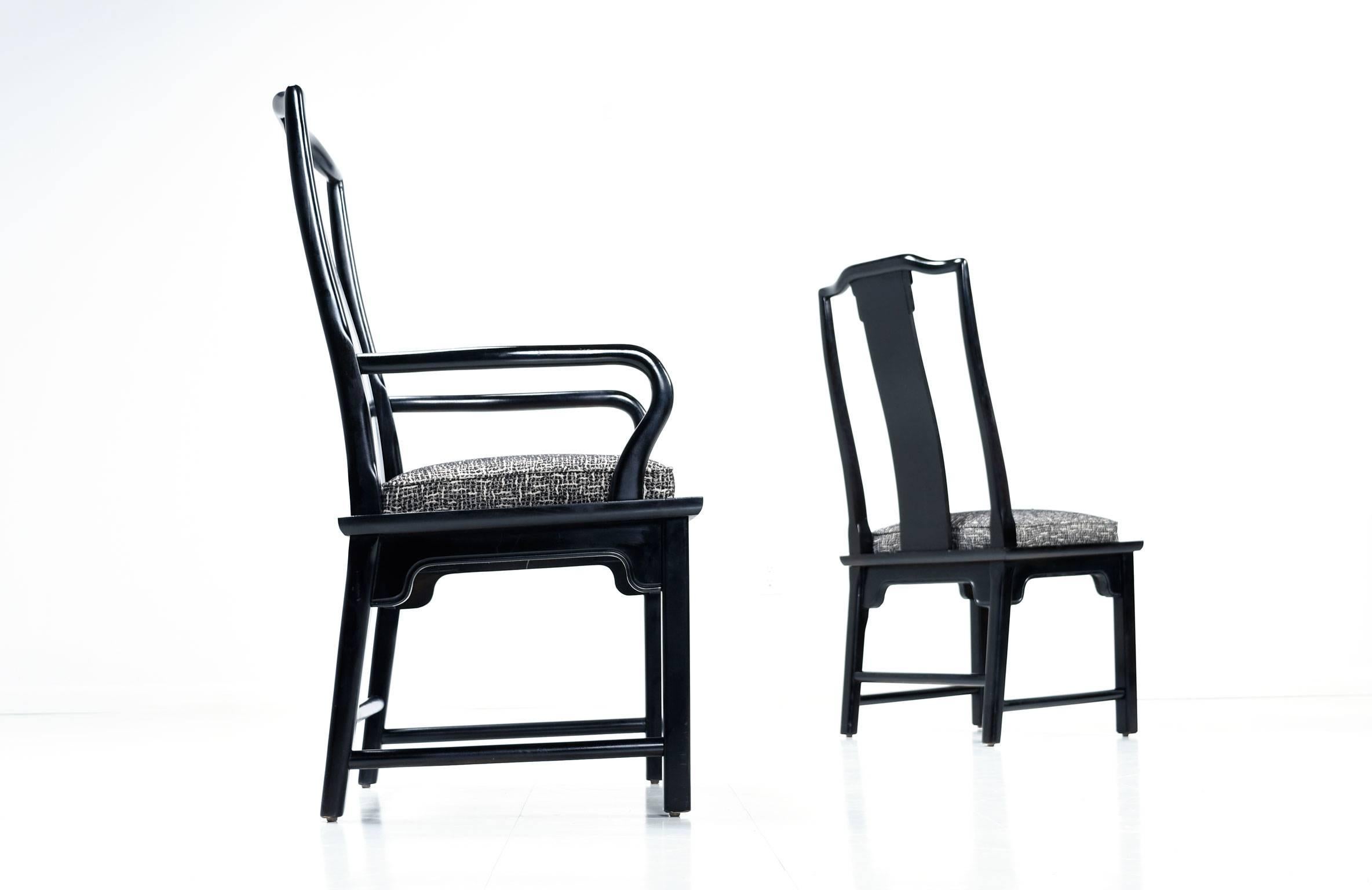 This sleek set of six black lacquer Chin Hua dining chairs by Raymond K. Sobota for Century Furniture add a modern Asian flair to any dining room. The set includes two armchairs and four armless chairs, all have a Classic Chinese motif carved into