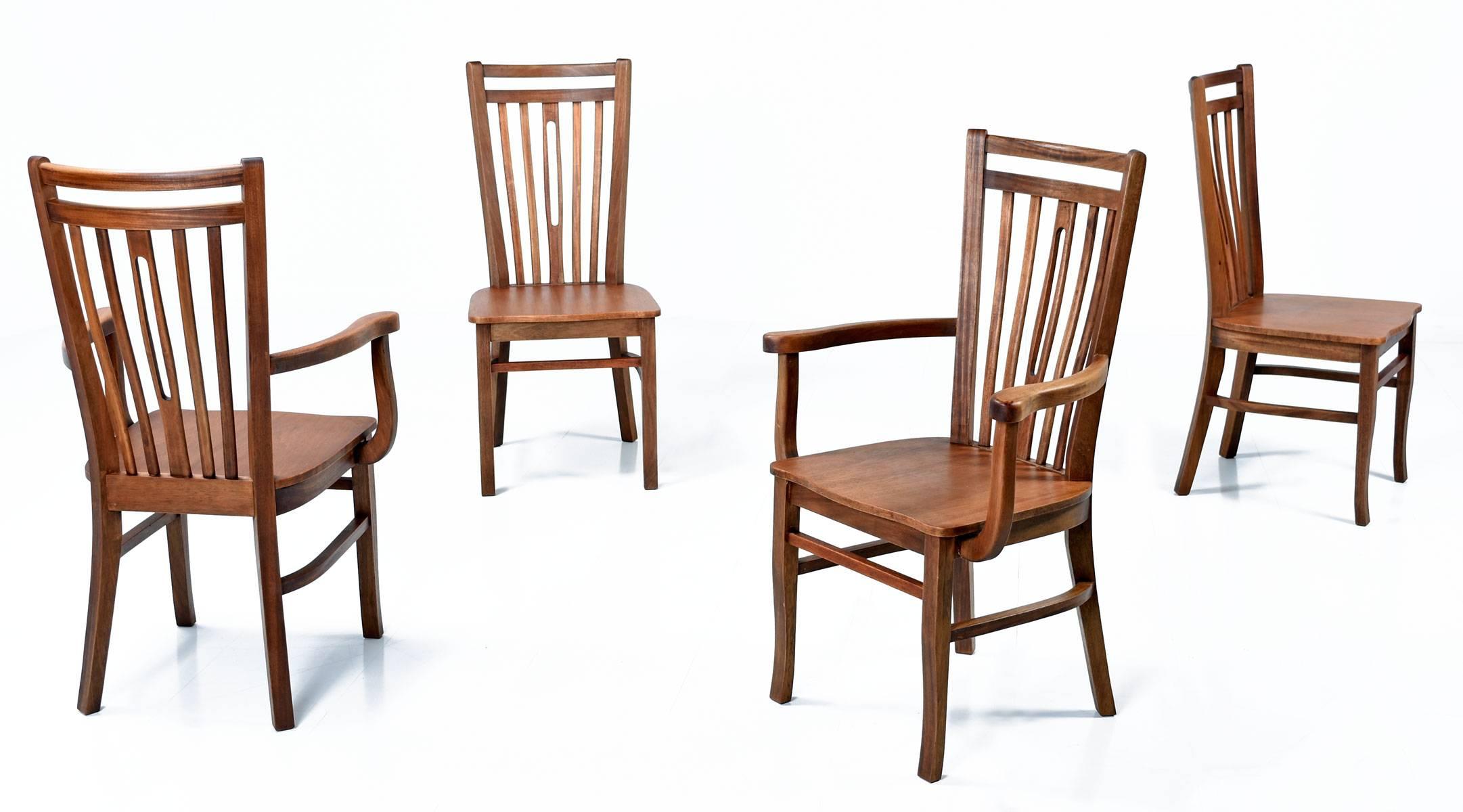 This remarkable set of four Mid-Century Modern dining chairs were handmade in Brazil, circa 1960s, out of exotic Brazilian hardwood. The set includes two armchairs and two arm less chairs.

Measures: Armchair 17