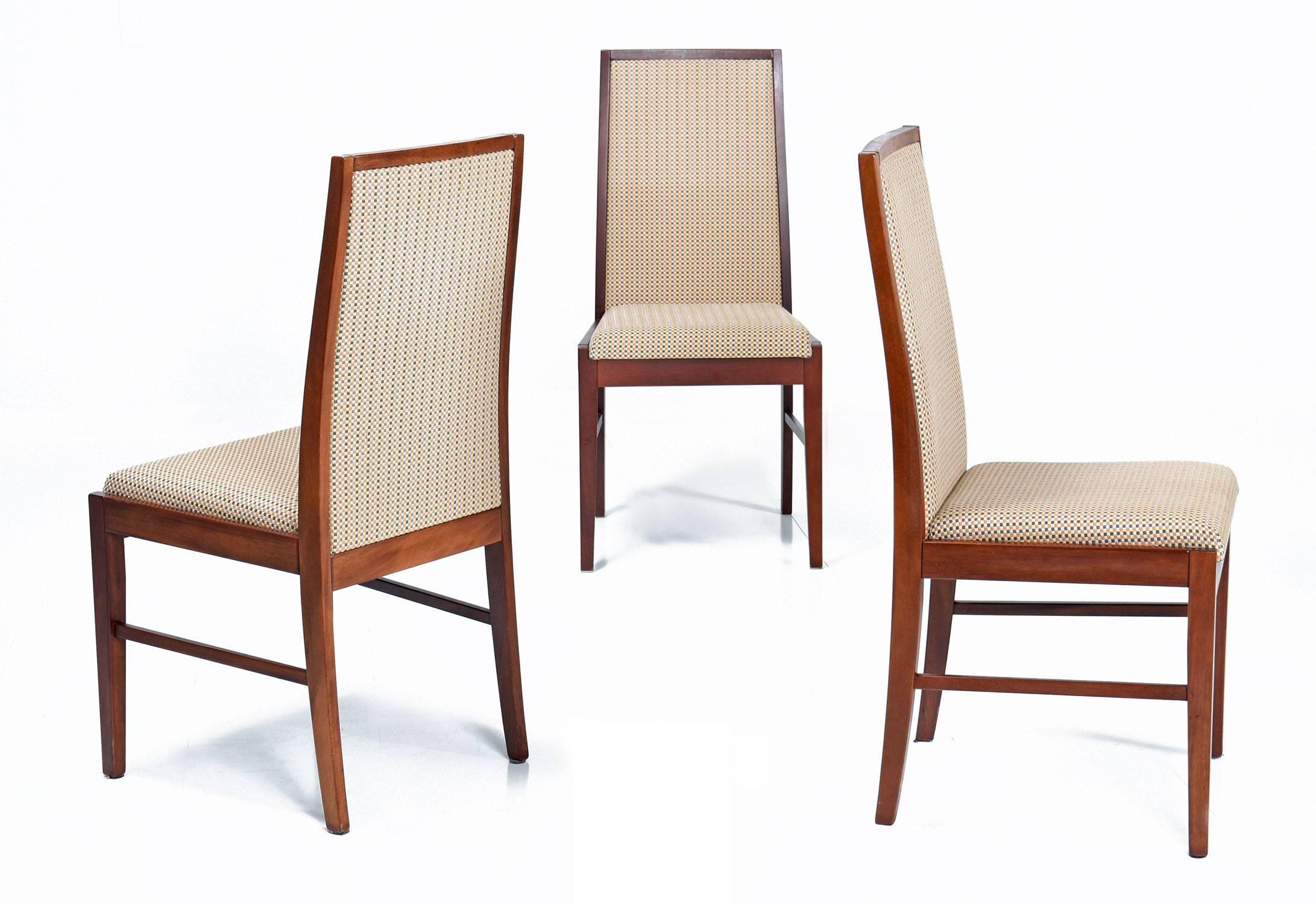Set of eight Mid-Century Modern style rosewood dining chairs made by Skovby in the 1990s. This set of eight armless chairs features an upholstered high back chair, which slightly curves to offer gentle lumbar support. The chairs are fully