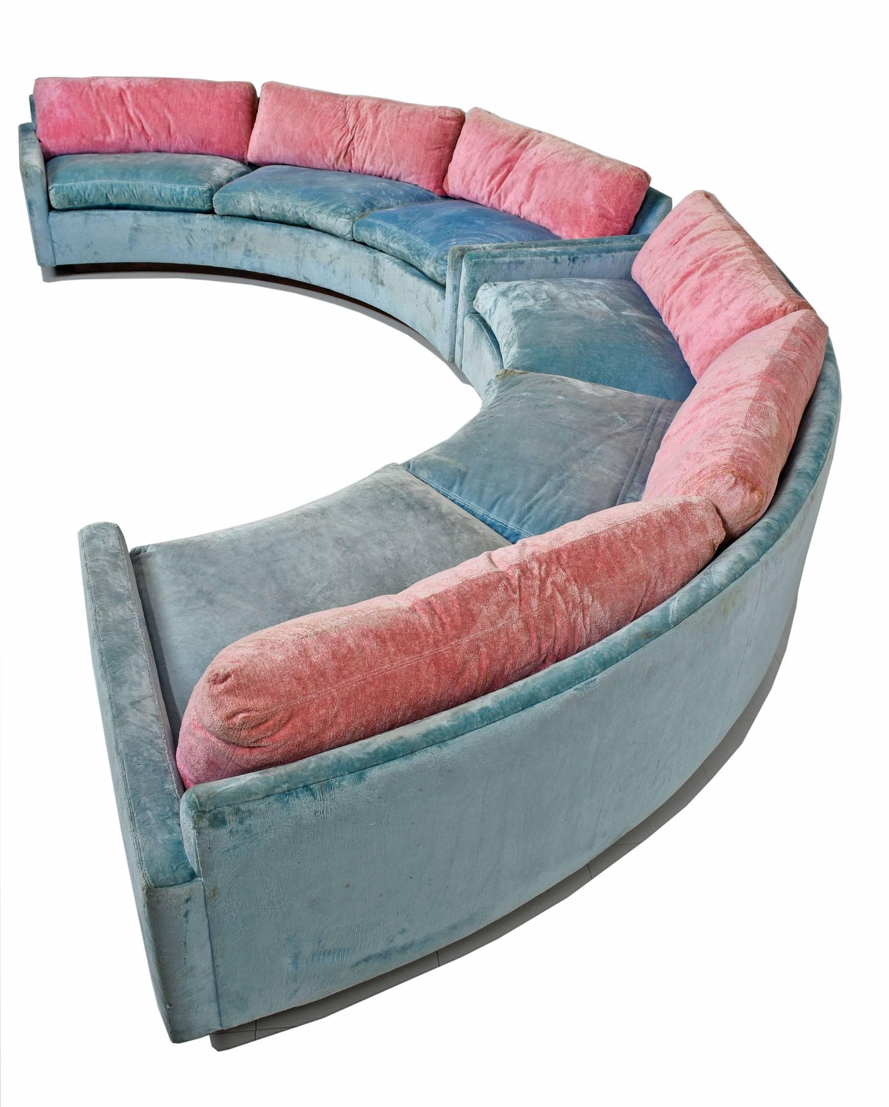 Mid Century Modern semi-circular sectional sofa designed by Milo Baughman for Thayer Coggin, circa 1970s. This sectional consists of two curved low profile sofas, each with arms at both ends making it possible to use separately or joined together as