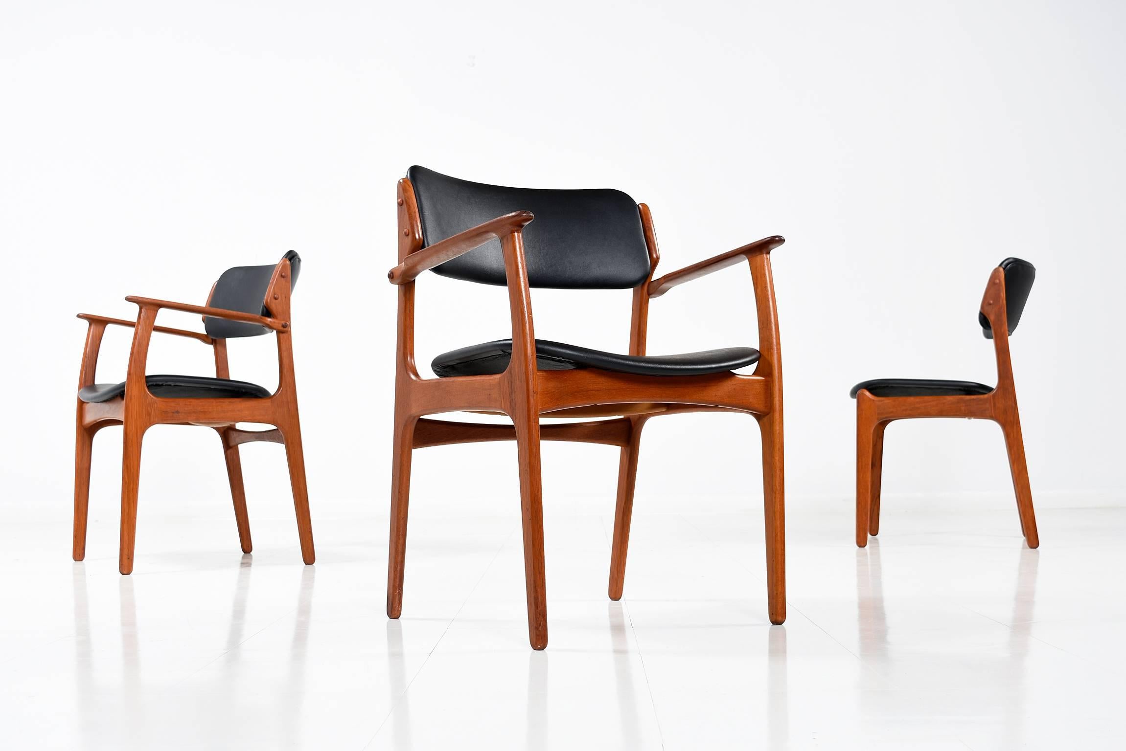 Gorgeous set of four Eric Buck, model OD-49 for O.D. Møbler, 1960s. These Classic Scandinavian Modern dining chairs are made of a solid teak frame, beautifully crafted and designed, featuring elegant floating seats and a deep curved backrest. The