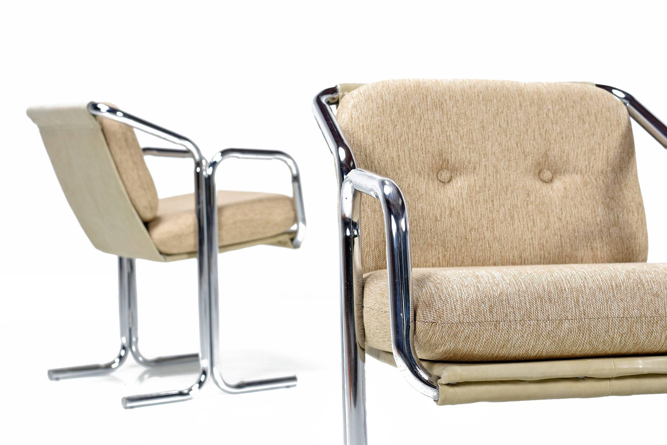 Set of four restored Mid-Century Modern Jerry Johnson chairs. The sleek, contoured, tubular chrome frames are signature Jerry Johnson. Seat is constructed of a vinyl fabric sling with the added support of wood in the bottom. These chairs have been