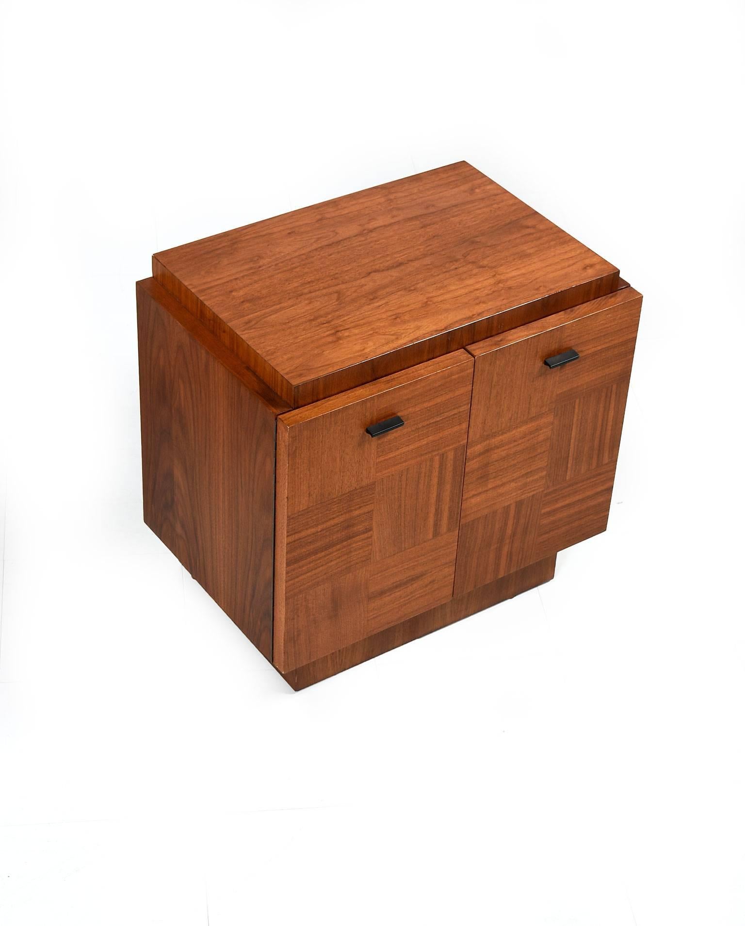 Pair of Mid-Century Canadian Brutalist nightstands. Time capsule pieces in outstanding original condition. Vintage, 1970s. Masculine, monumental form is accented by a handsome parquet walnut wood. Highlights of the parquet opposing grain are