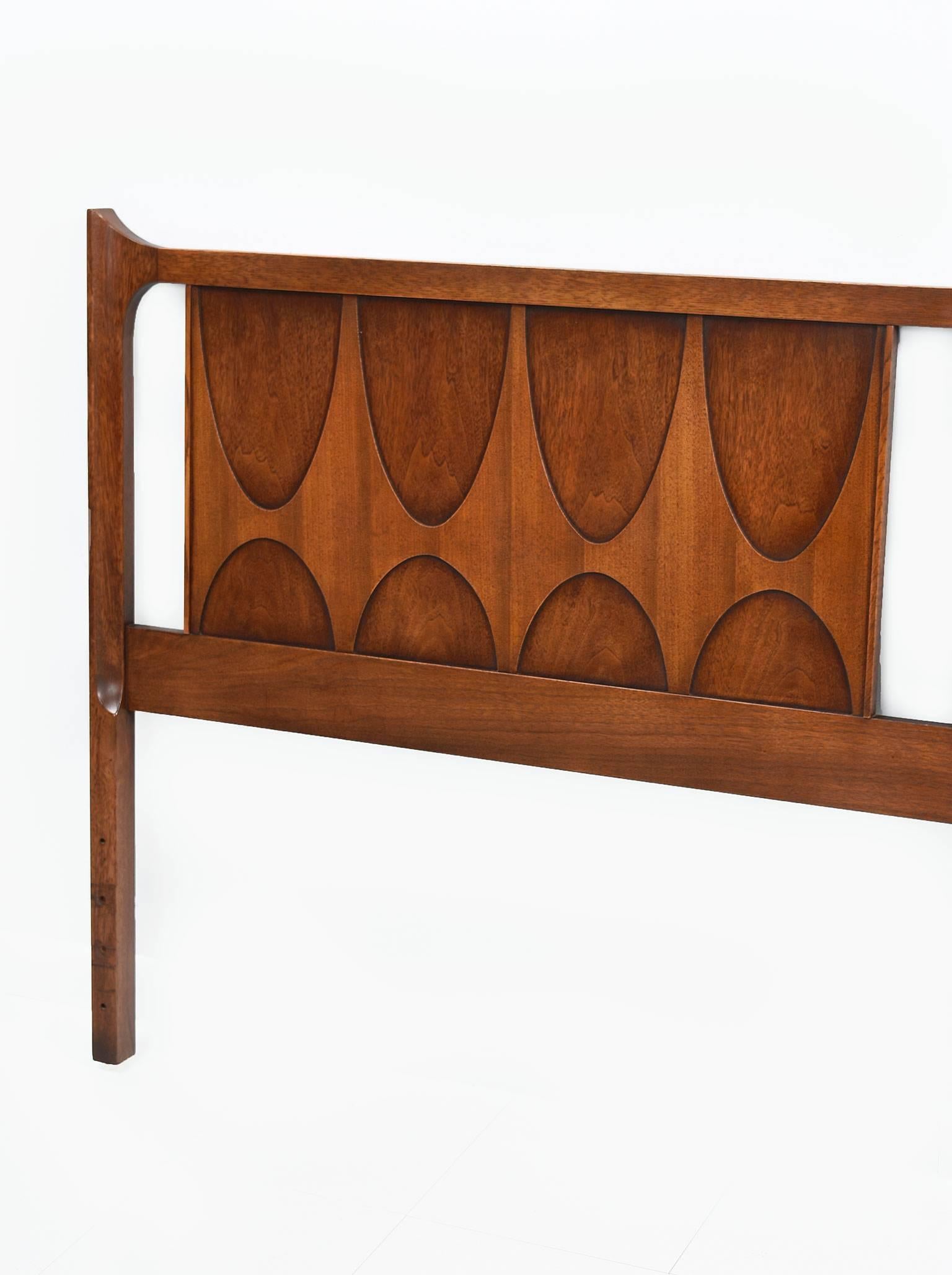 Dark walnut Broyhill Brasilia king-size panel headboard designed by famous Brazilian designer/architect Oscar Niemeyer for Broyhill in the style of Danish Modern. Superior craftsmanship and quality. American furniture manufacturer Broyhill created