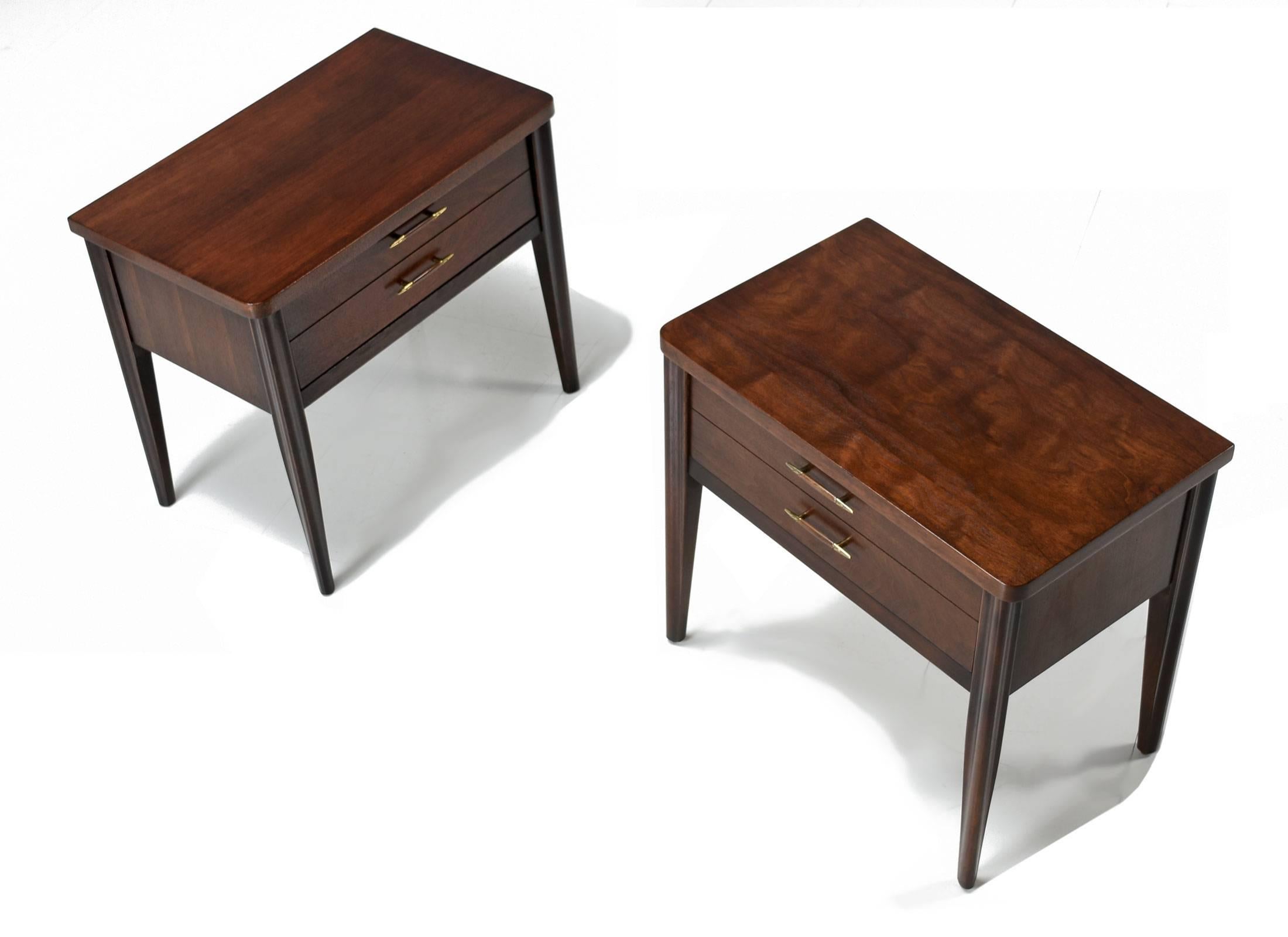 Pair of professionally refinished Broyhill saga nightstands. One of the most celebrated lines of the Mid-Century Modern Broyhill Premier series. This set of Saga nightstands features Danish inspired Minimalist styling with a touch of American flare