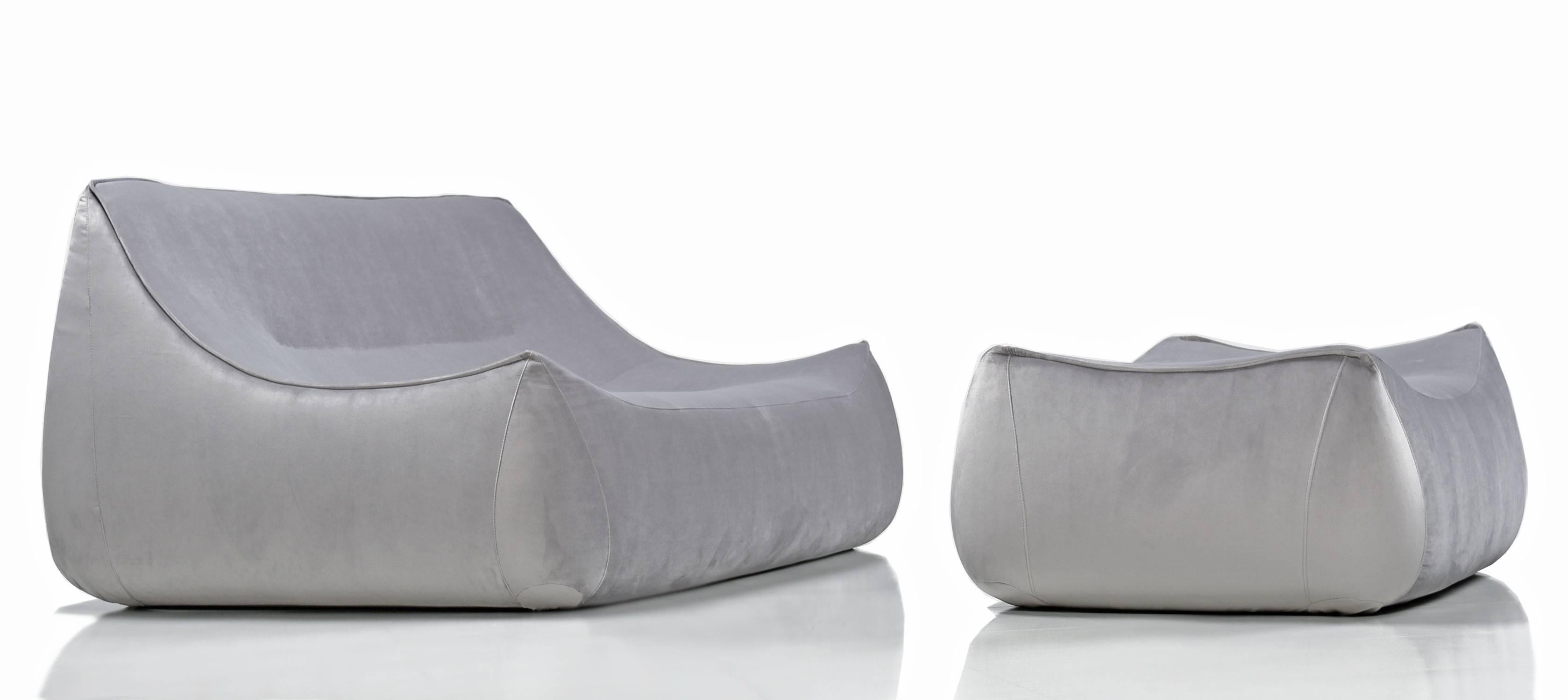 Vintage Ligne Roset sake settee with matching ottoman. The sake was a limited release by French company Ligne Roset designed, by Pascal Mourgue, and is no longer available. The sake emulates the leaf-like design of Ligne Roset's staple