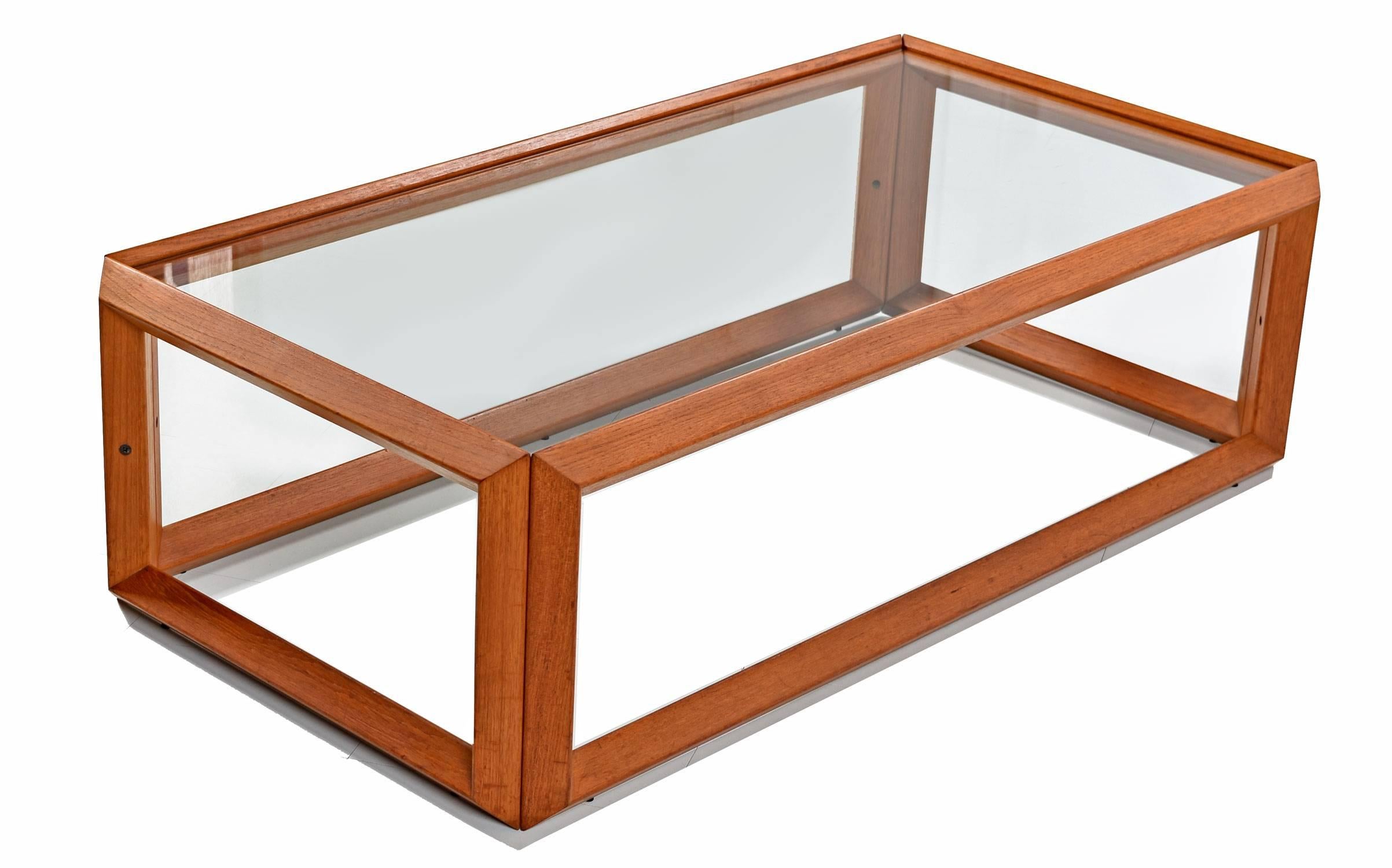 Vintage Danish modern style coffee table and (two) side tables made of solid teak and glass. All with open style teak frames allowing one to see through the form. A single pane of glass rests within the top layer of the frame to create a table