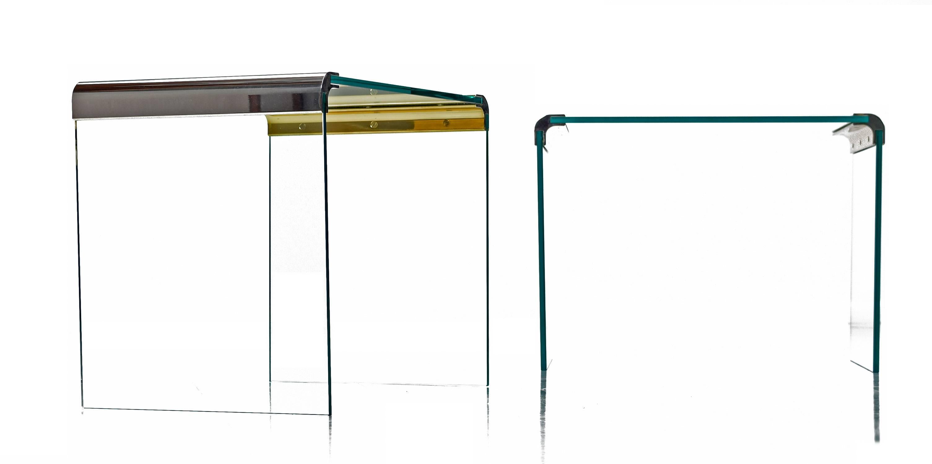 A pair of Leon Rosen chrome and glass waterfall side tables for Pace Collection. Rounded edge chrome hardware supports thick sheets of clear glass. 
Three new sheets of glass were cut for the restoration of these end tables. Only minor scratches