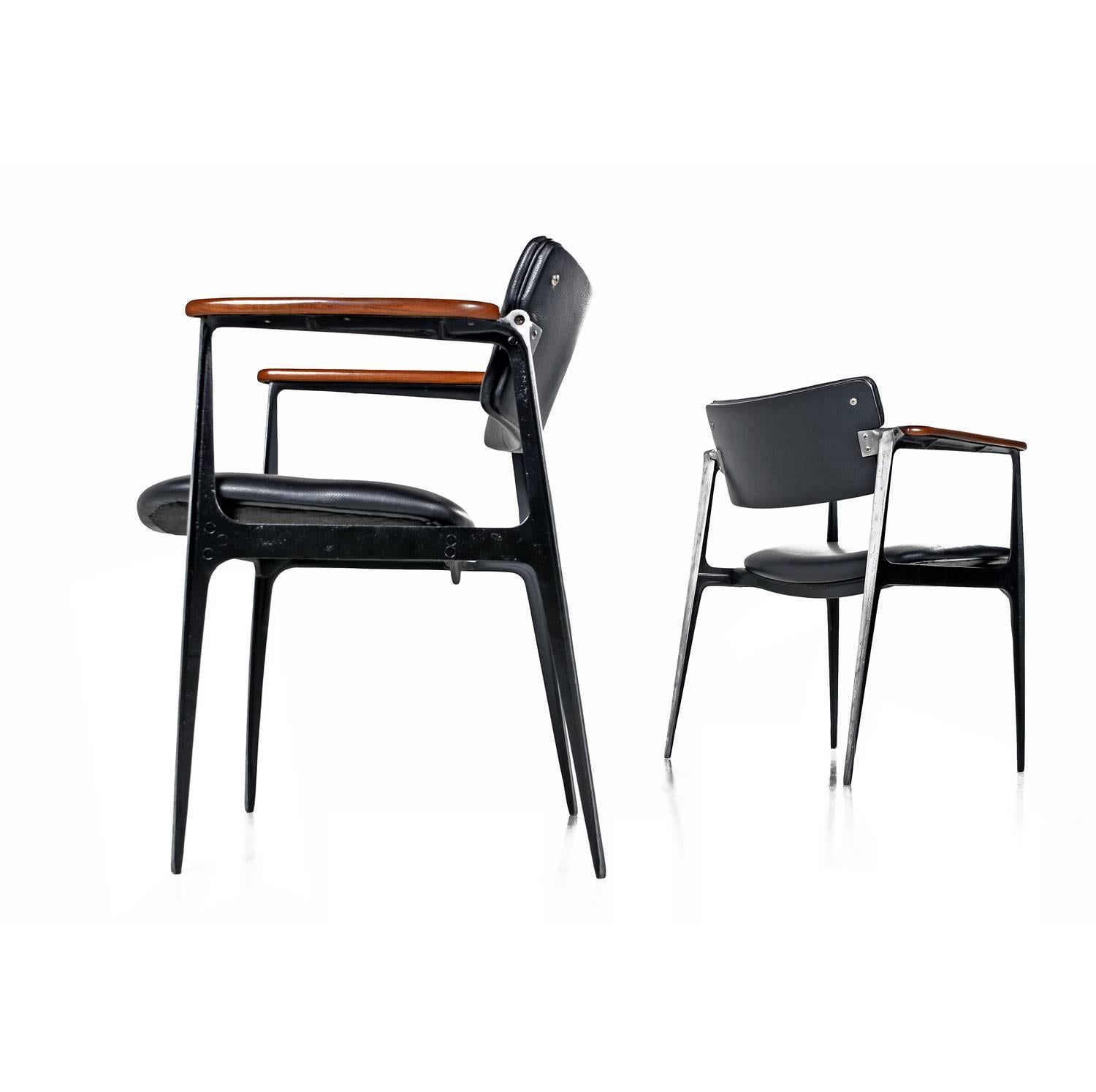 Metal, walnut and leather. Three elements blended perfectly and sculpted into functional art. The cast aluminium body acts as a framework for the floating seats and swivel backs that have just been professionally reupholstered in black leather. The