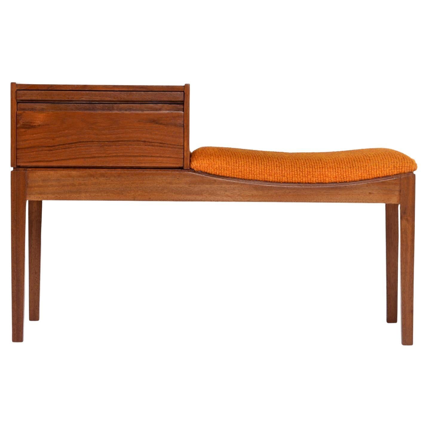 Chippy telephone seat Mid-Century Modern gossip bench, made in England. The Mid-Century Modern teak gossip bench has it's original orange fabric on the seat! Truly remarkable that the upholstery has remained in such great shape after over half a