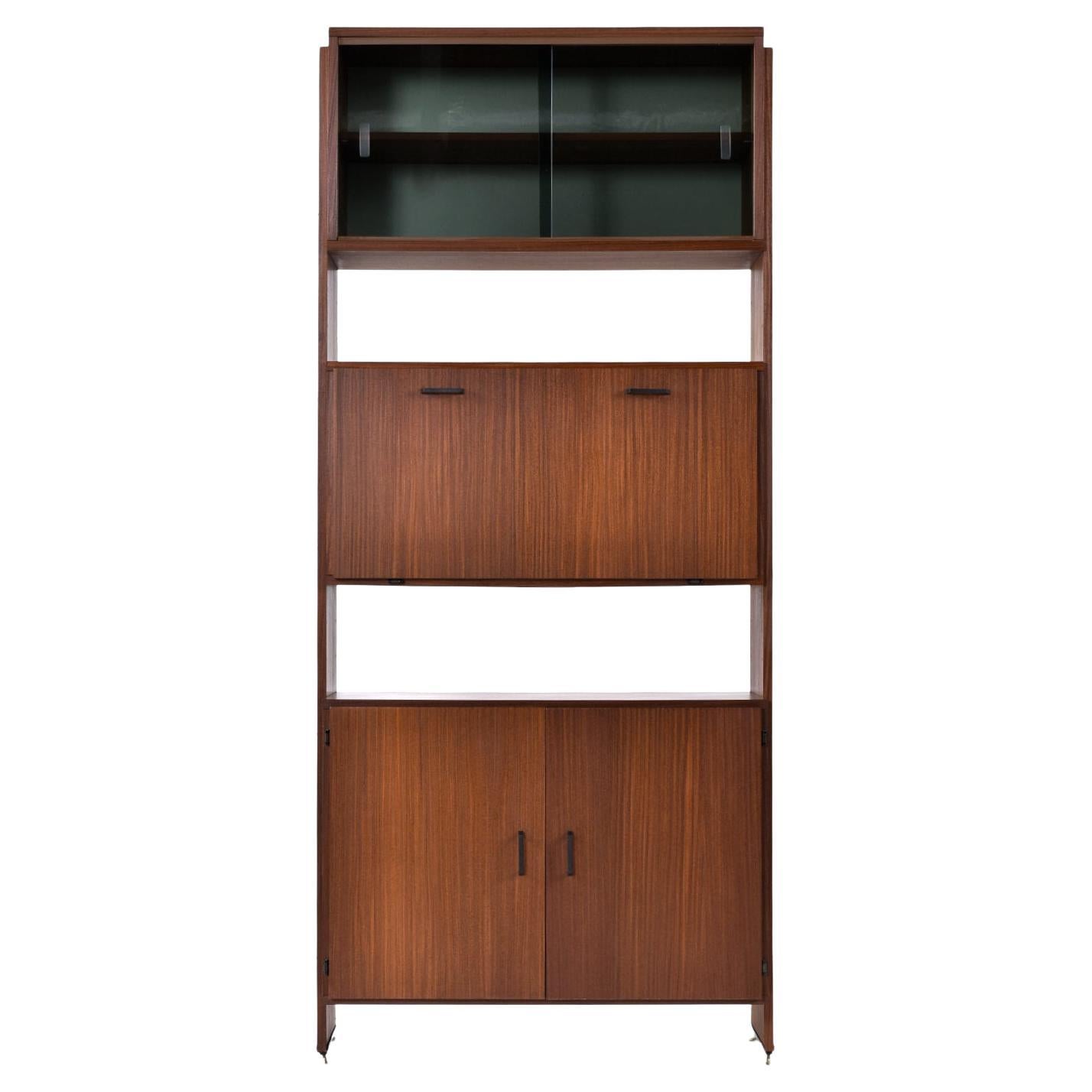 Versatile Mid-Century Modern bookcase hutch with many storage options. This piece packs a lot of versatility. The open shelving makes it useful as a bookcase. The drop down door cabinet can be used as a secretary writing desk or bar. Keep glassware