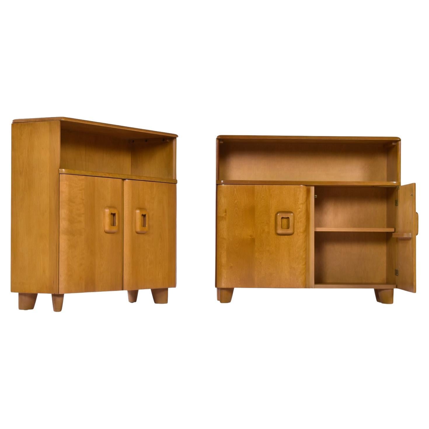Versatility abounds with this Pair of Heywood Wakefield cabinets. Coffee bar, book case, or entryway console are just a few ideas. As a dry bar, the adjustable / removable shelf will allow you to keep that whiskey collection cozy. Flank your bed for