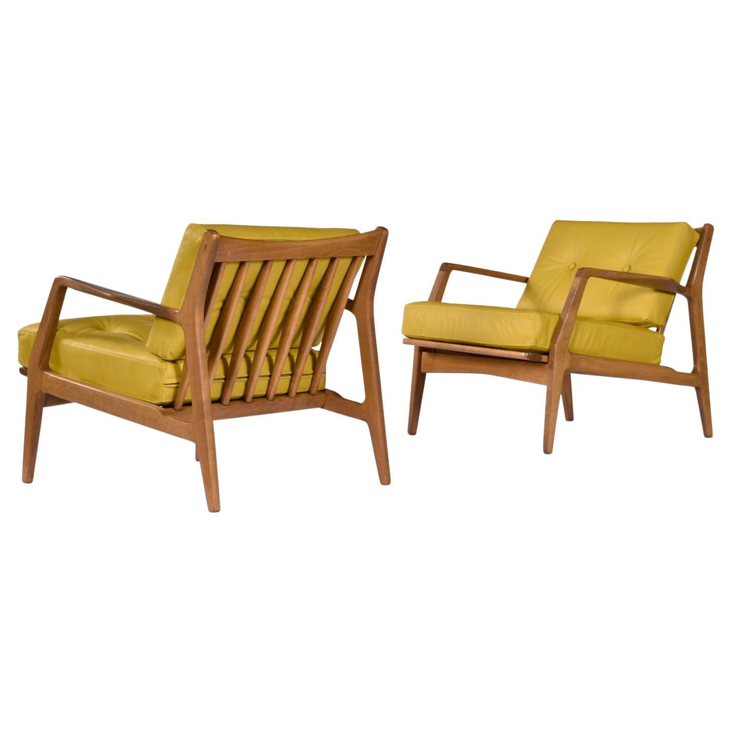 Pair of Mid-Century Modern Number 596 lounge chairs designed by Lawrence Peabody for Selig. Professionally reupholstered in full grain flaxen-yellow leather. These timeless lounge chair exudes the quintessential Mid-Century Modern style that has