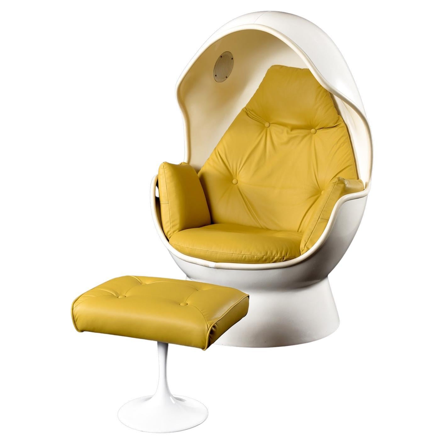 GO TO YOUR WOMB!!!  This is sold as a set (chair & ottoman)

This dazzling, distinct and bizarre gem from the early 70's ran with the tagline “Stereo Lays An Egg” and combined the iconic egg chair & ottoman with built-in speakers for the ultimate in