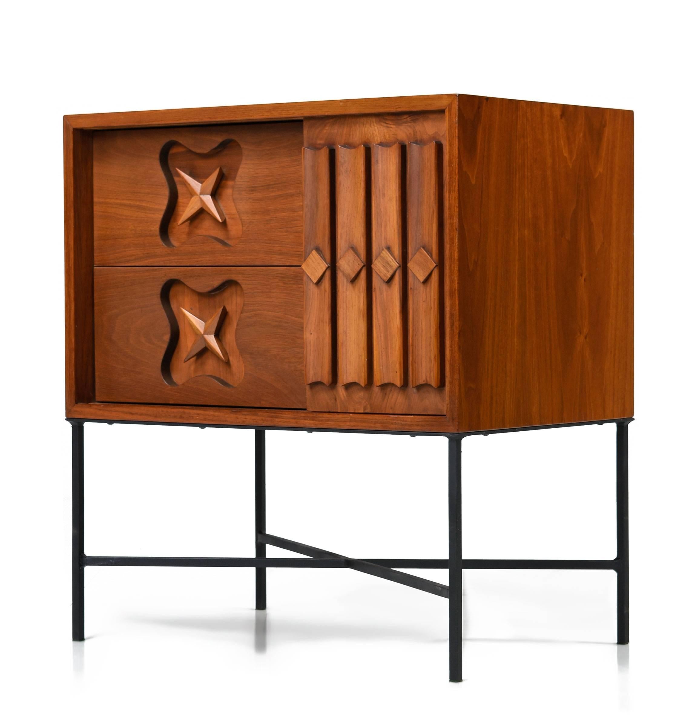 Pair of one-of-a-kind Mid-Century Modern nightstands with star accent and custom-made base. The original Mid-Century Modern walnut cabinets have been professionally refinished and mounted to custom-made, hand welded, steel bases. There aren't