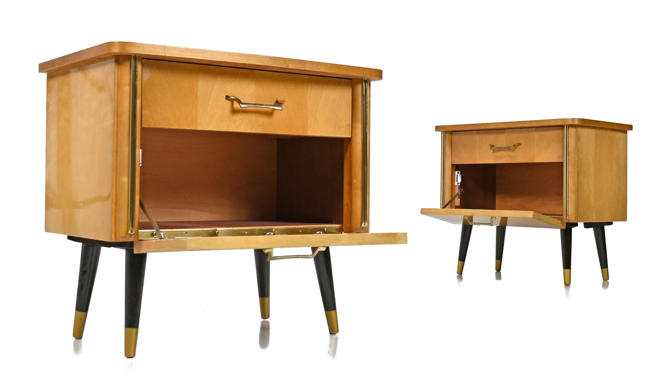 Pair of Mid-Century Modern German birch nightstands. Known as the Rockabilly style in German and Memphis style in the U.S. One can easily picture these funky vintage 1950s cabinets in the home of an early rock legend. The golden birch wood is a