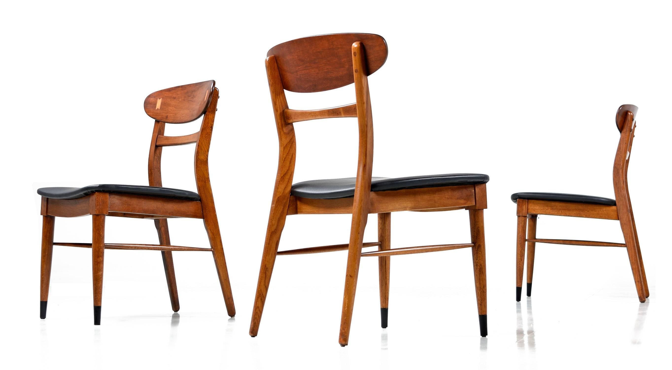 Rare set of eight Mid-Century Modern Lane Acclaim dining chairs. Lane's Acclaim line is one of the most beloved and collected series of American Mid-Century Modern furniture. The solid walnut frames feature novel period styling informed by Danish