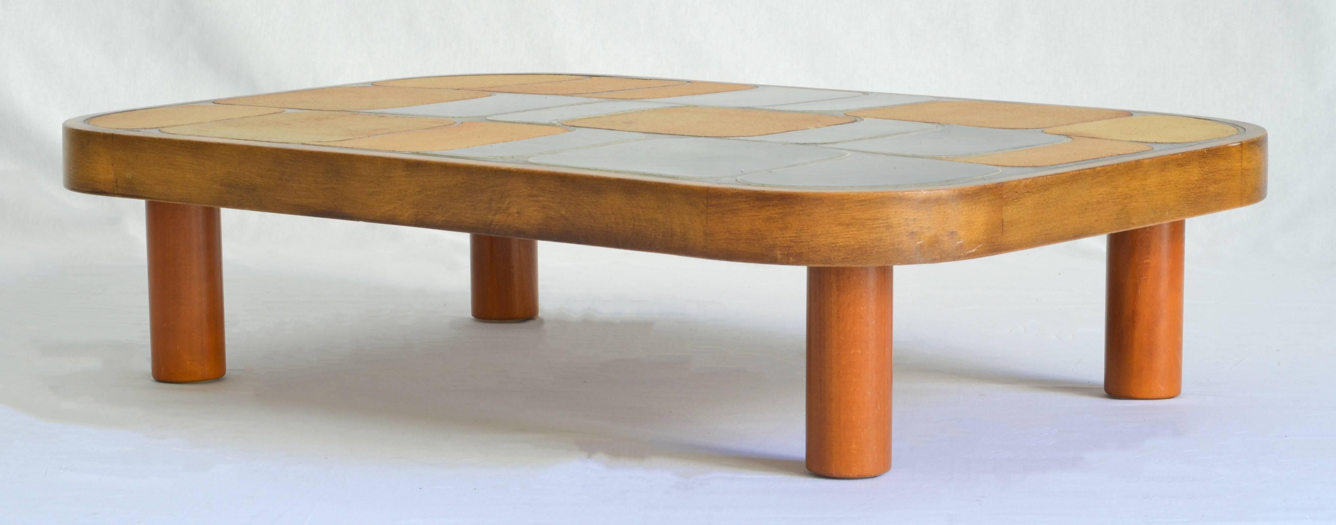 Low table in wonderful condition by Roger Capron with warm beige and forest green tiles.