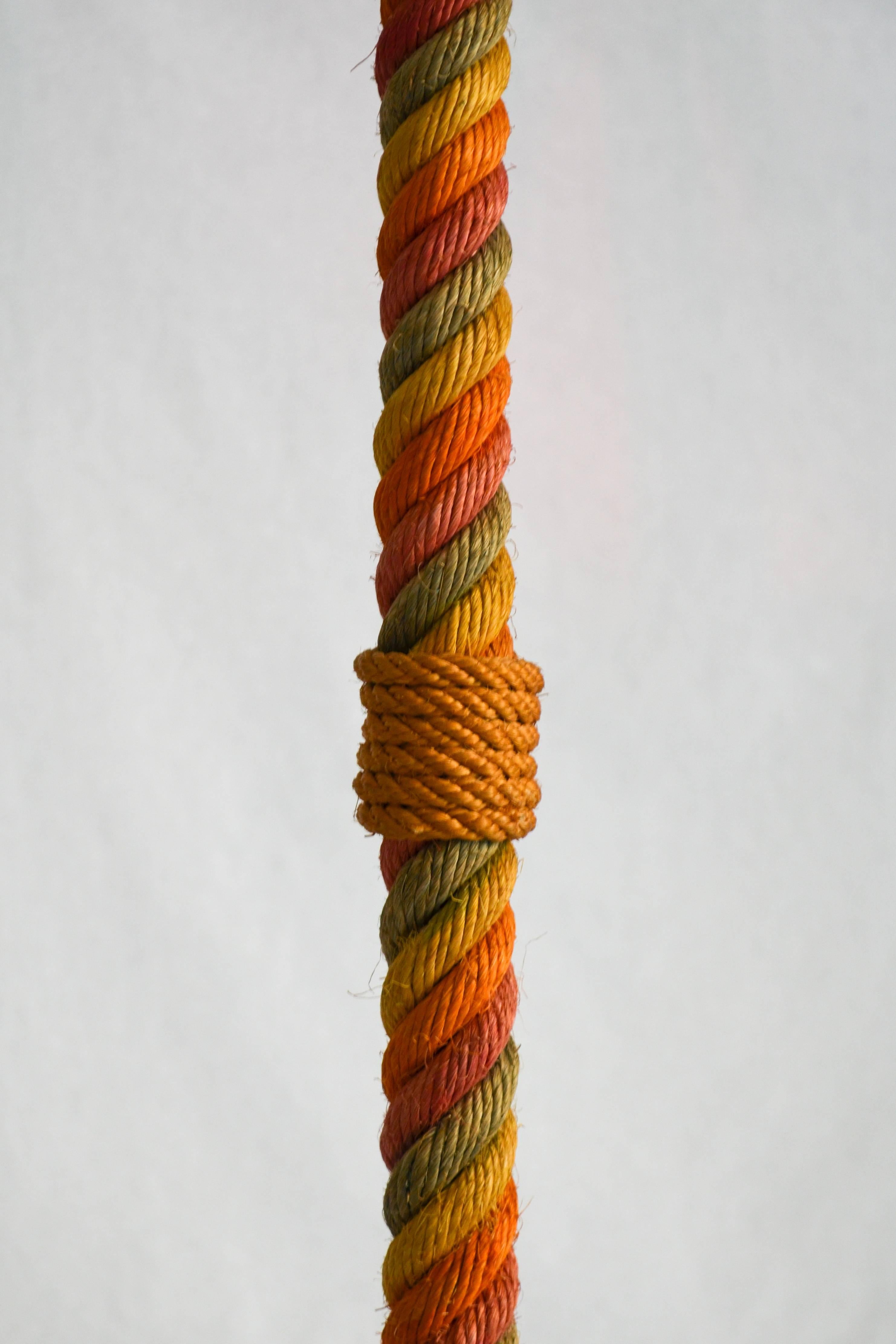 Multicolor rope-wrapped floor lamp, rewired with twisted silk cord and a semi-enclosed shade for pleasant light diffusion.