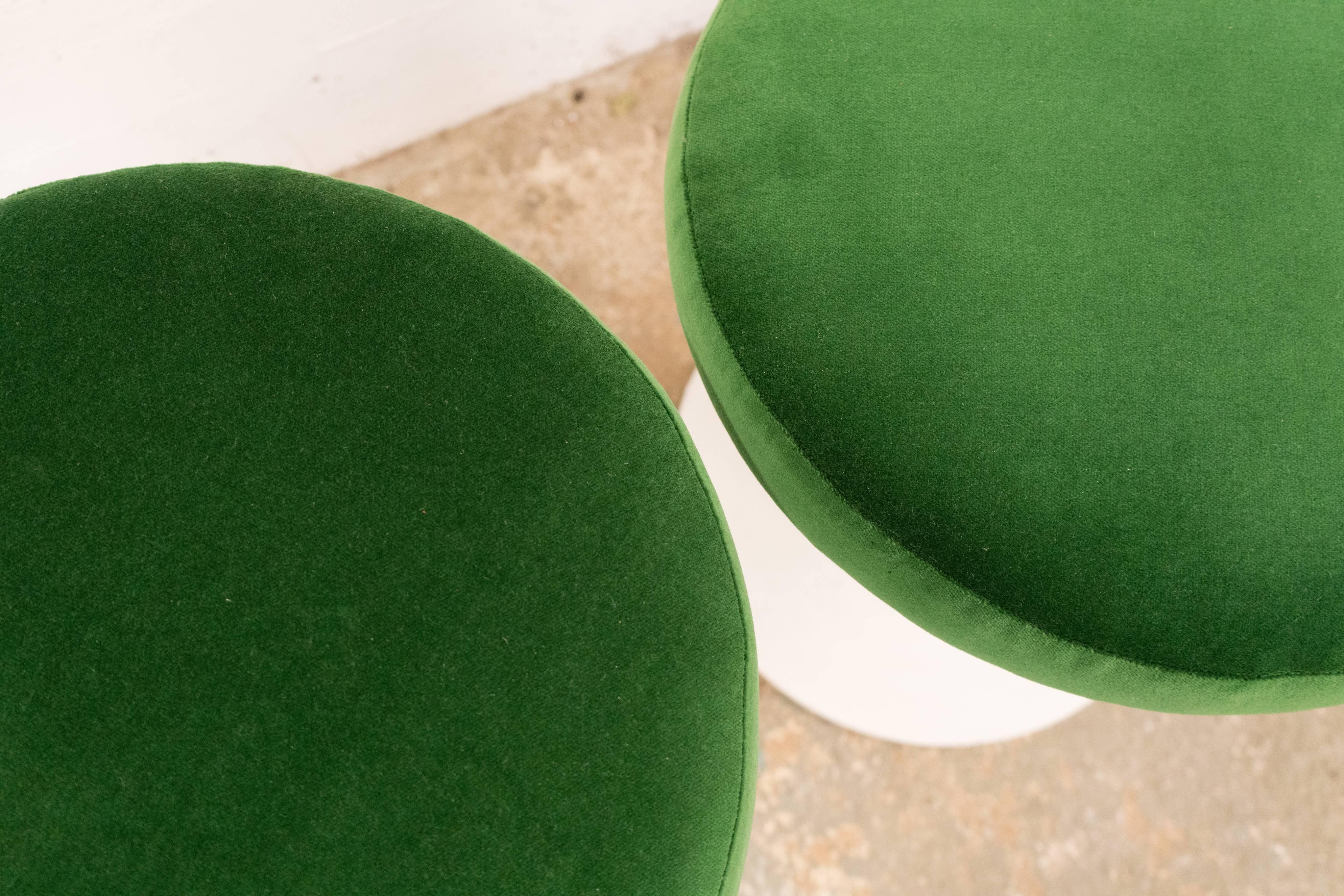 Four Eero Saarinen for Knoll stools, newly upholstered in a lush green velvet.