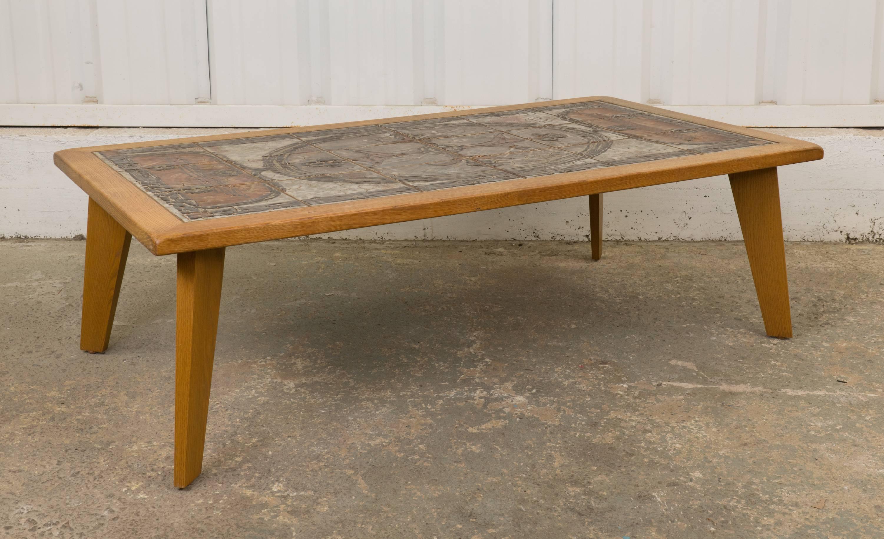 1960s Danish wooden coffee table with tile top. Large tiles create a whimsical, architectural scene.