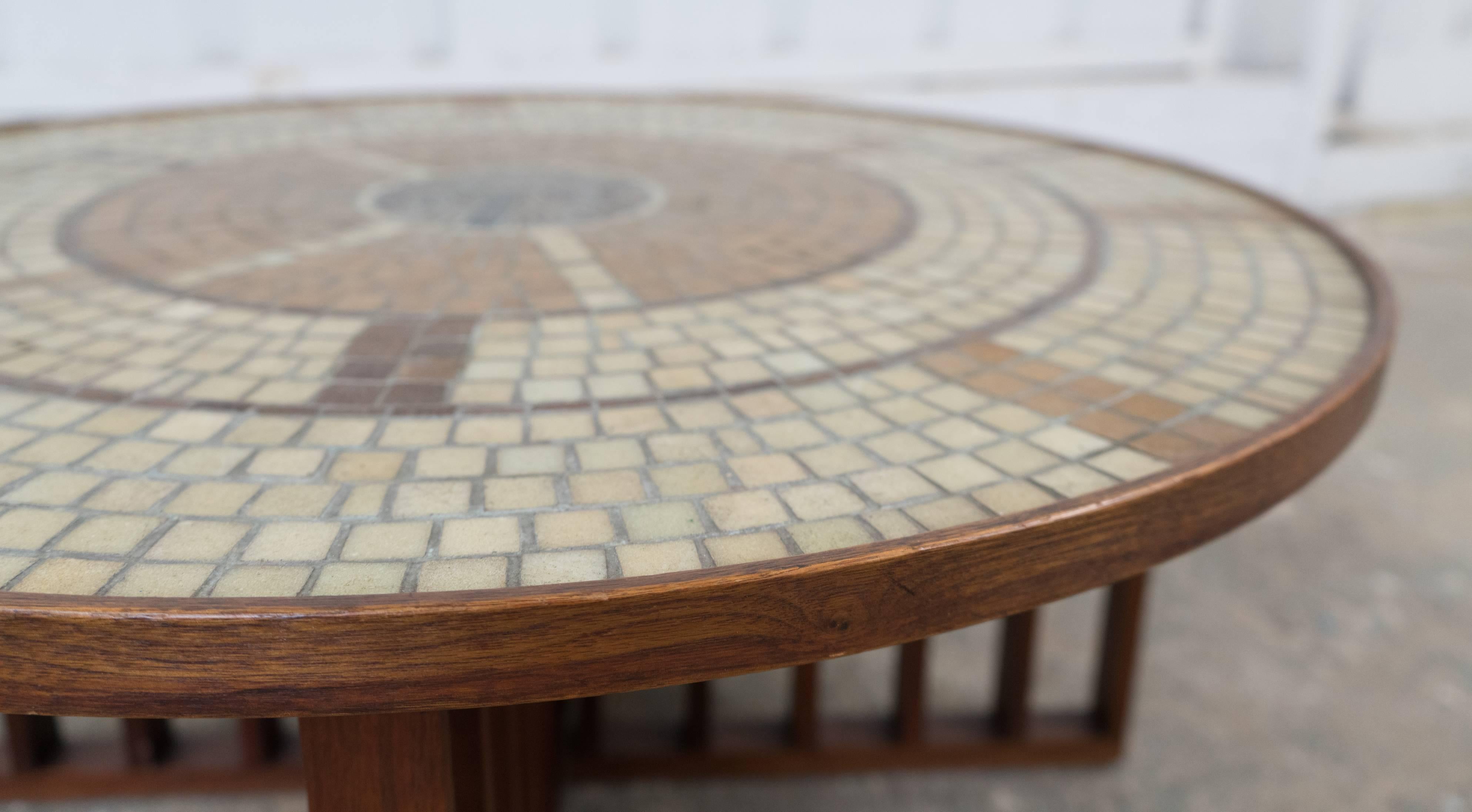 Excellent condition walnut coffee table with concentric mosaic design of glass tiles from the 1960s.