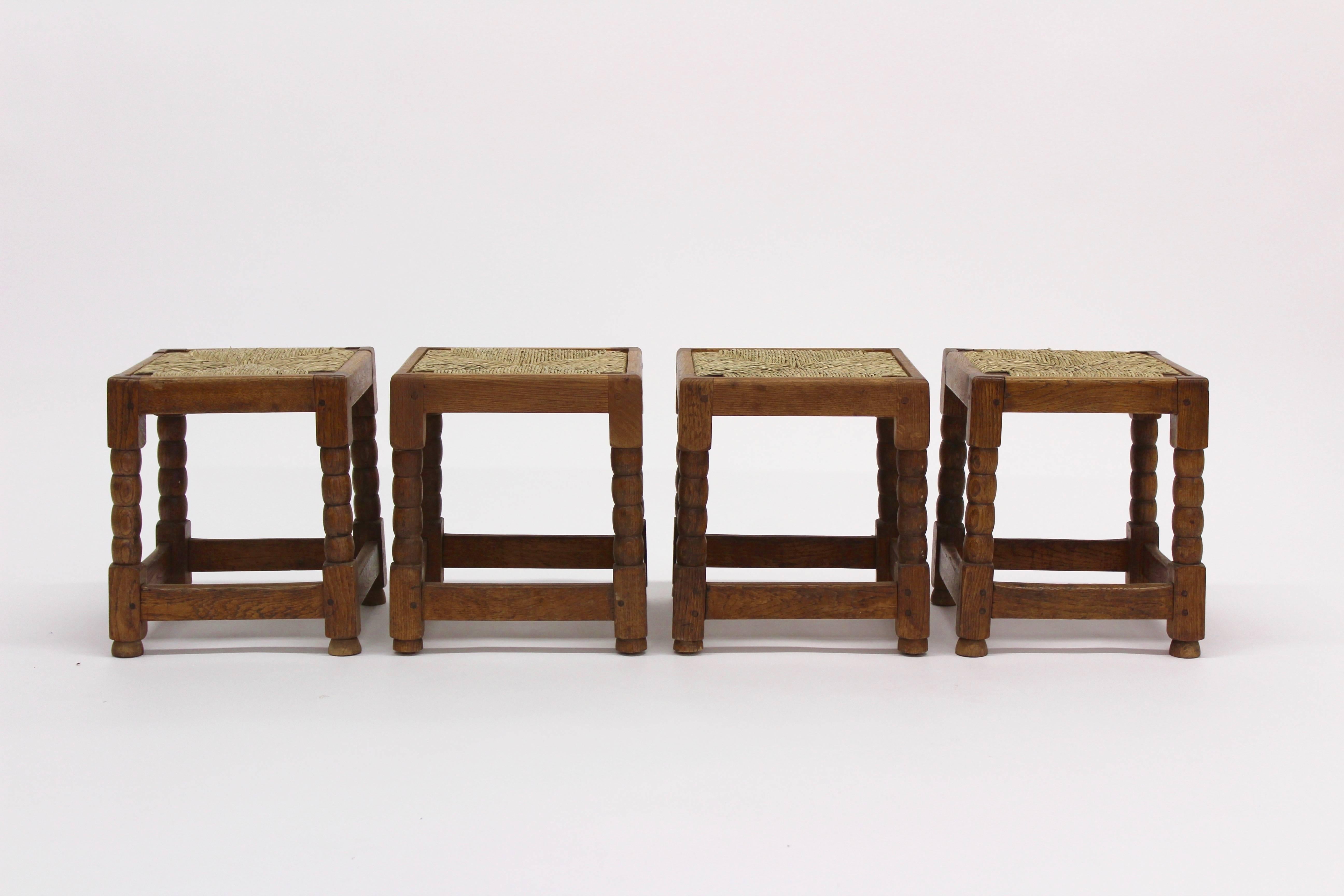 Two charming, versatile wood and rush stools from England, circa 1910/Arts & Crafts. Perfect for a seating perch, extra table surface or foot stool.

 