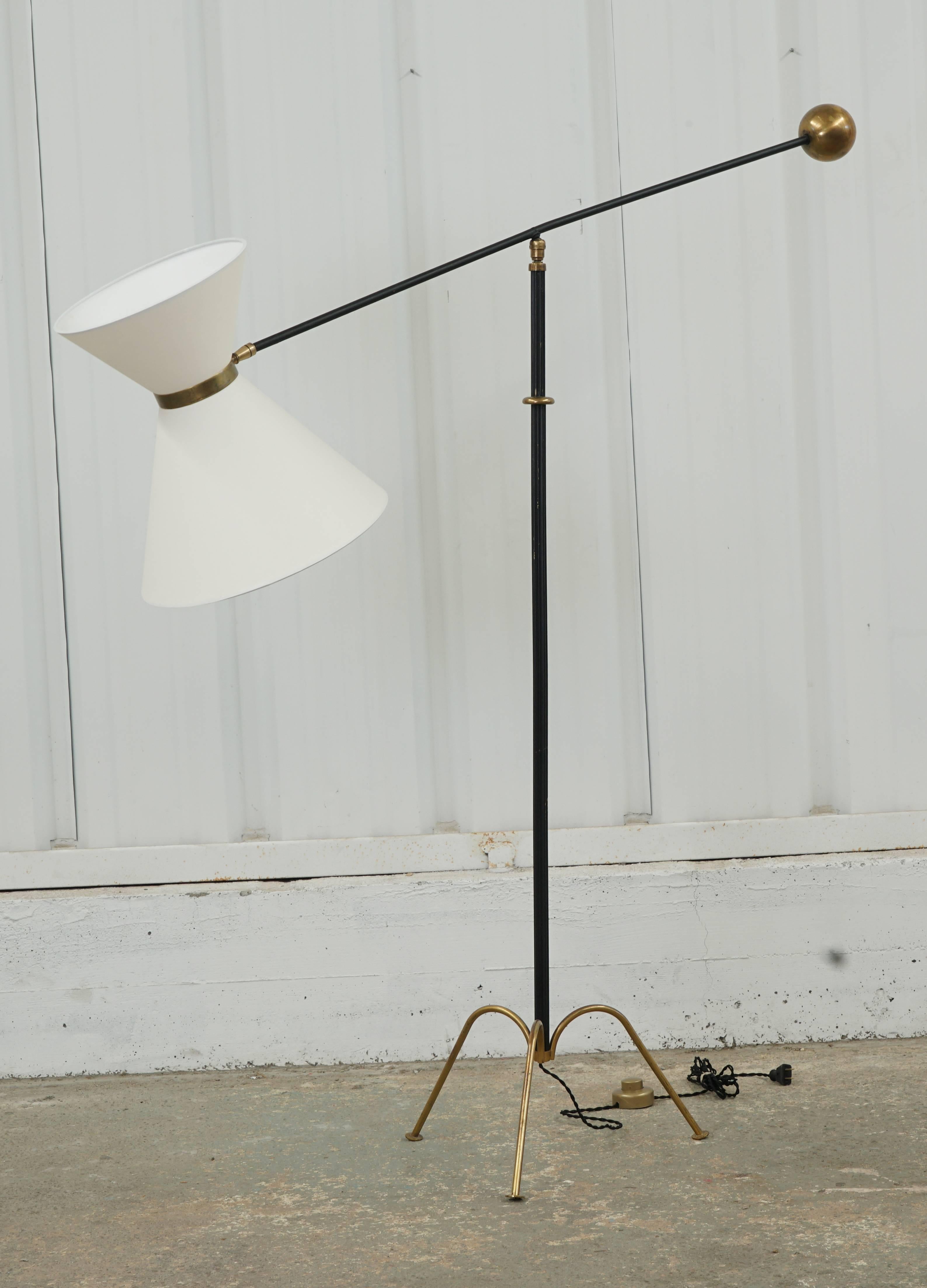 Iron reading lamp with paper shade and brass details including ball counterweight, shade band and three-legged base. Shade articulates as well. (See pics).