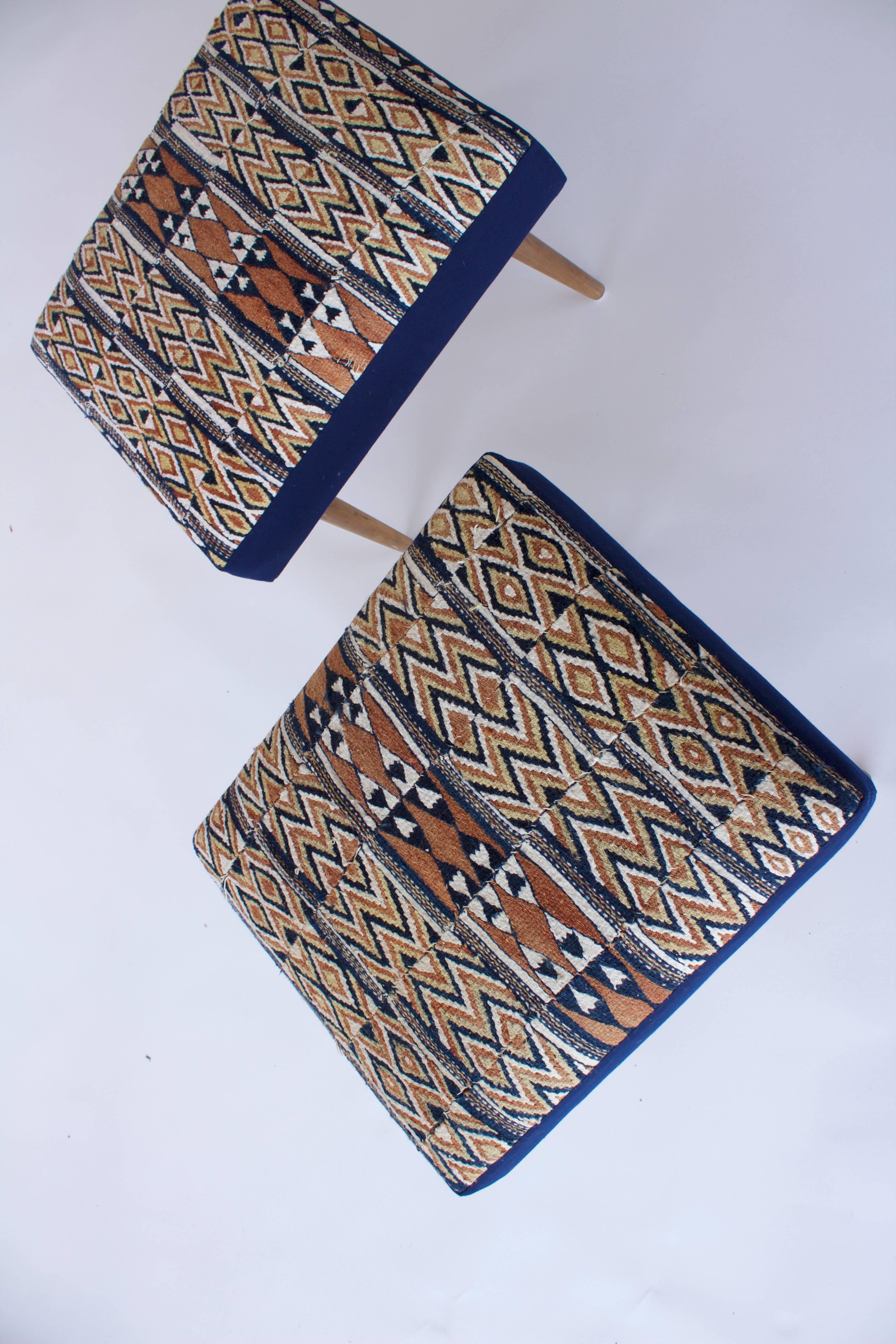 Handy upholstered pair of vintage stools from France in the Mid-Century newly upholstered in a great vintage African textile.