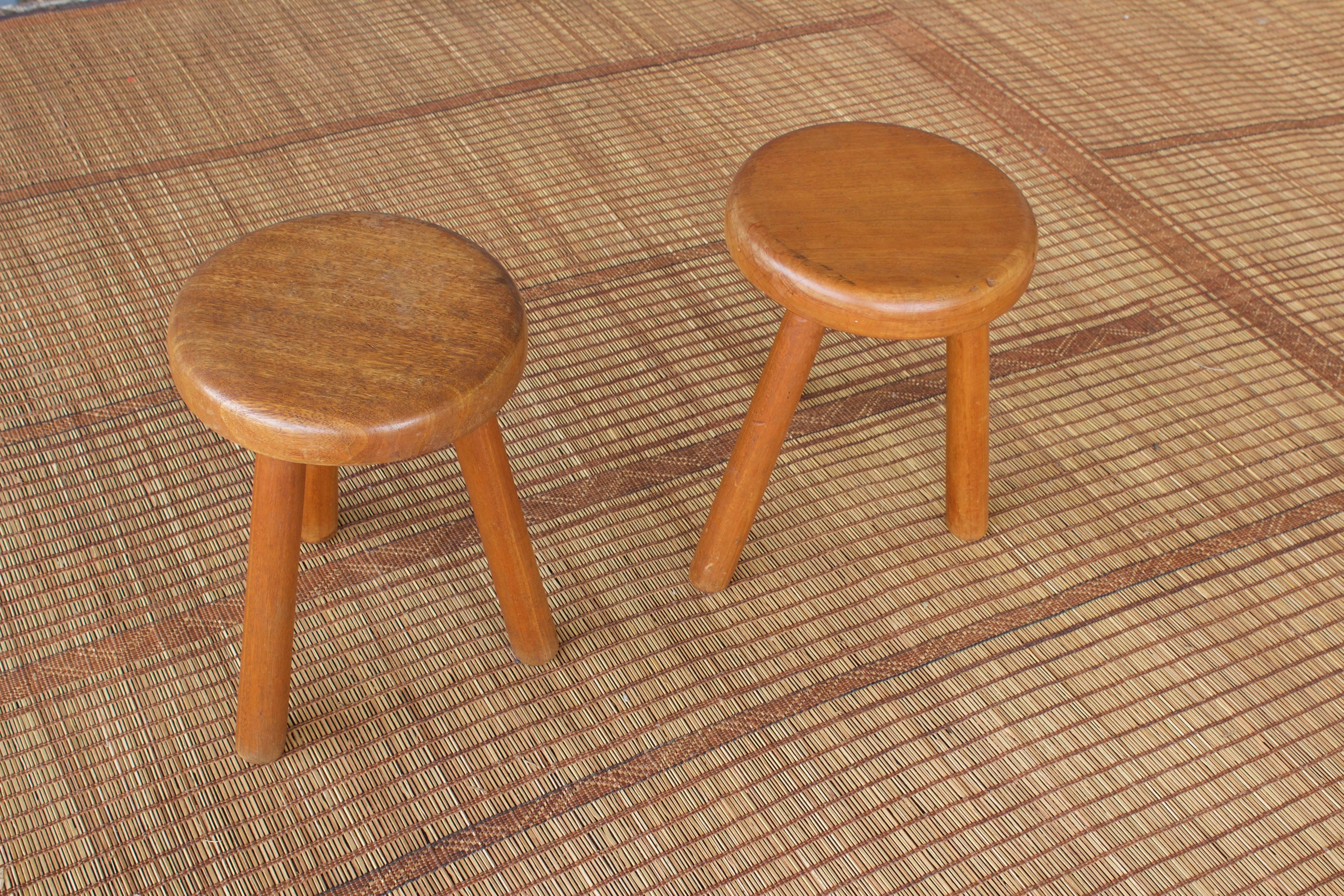 Simple, sculptural milking stools from France in the 1960s made from bleached mahogany.