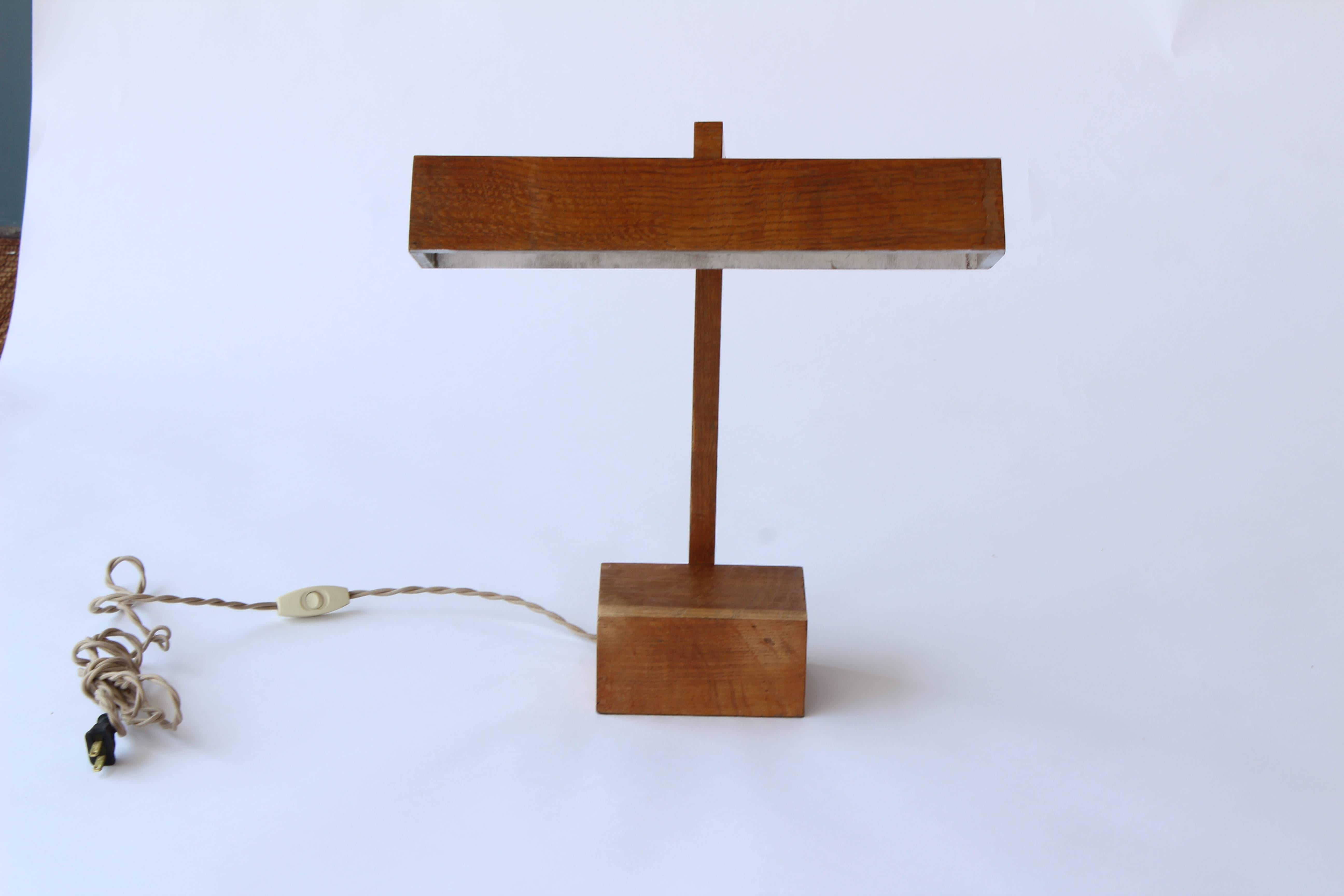 One of kind vintage French desk lamp from the 1940s with an articulating head. Flip through photos to see adjustment Scope. Newly wired with silk-wrapped cord.