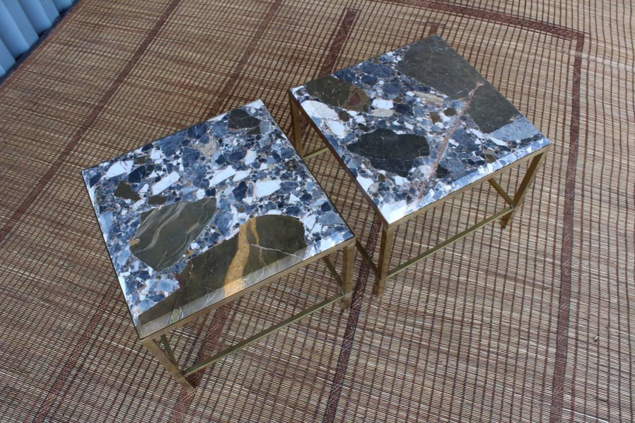 Fabulous pair of vintage brass side tables by Maison Jansen, topped with custom cut stone tops with a beautiful beveled edge. Both tables in the pair are signed.