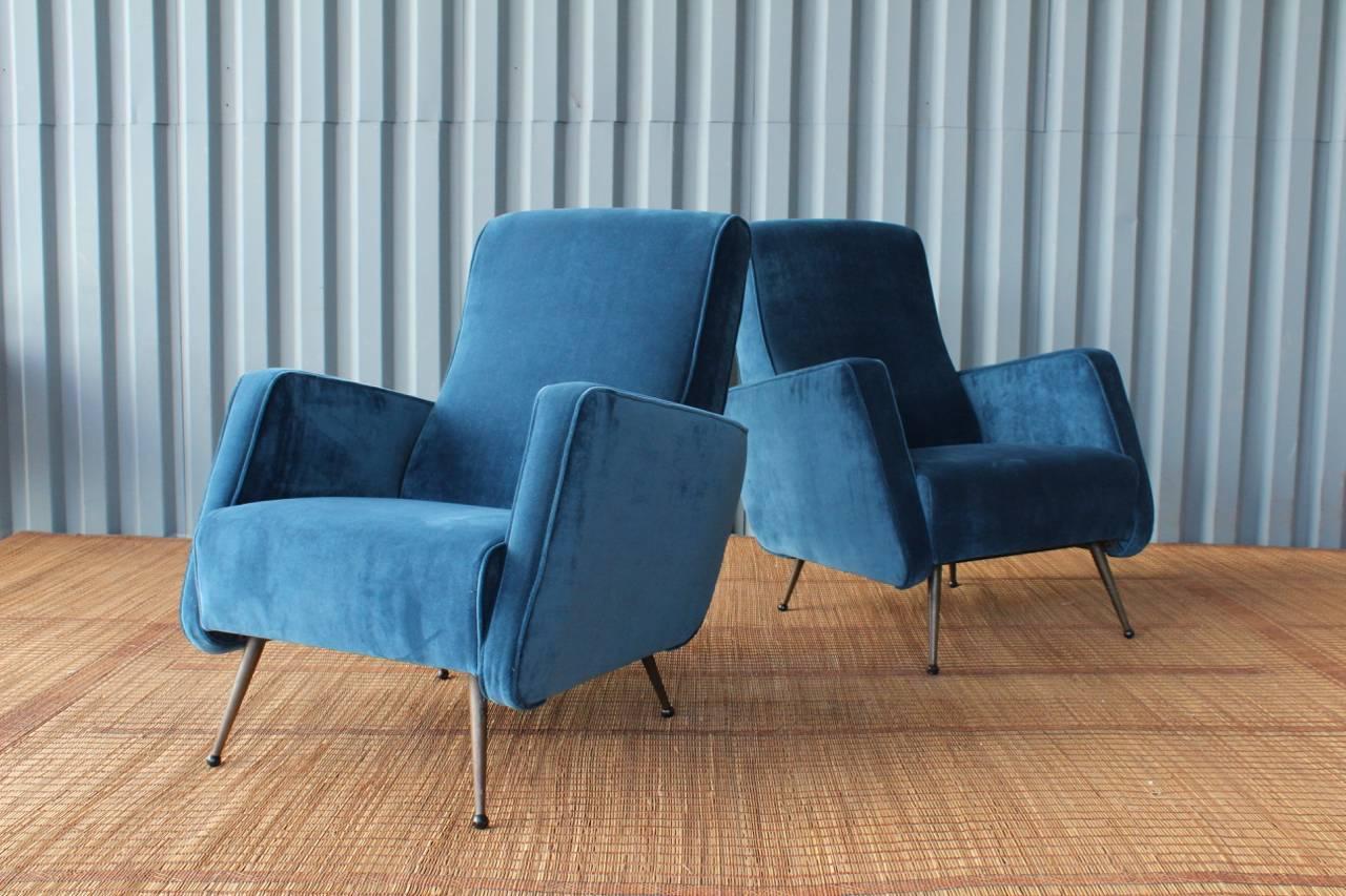 Pair of midcentury Italian armchairs with original metal legs. Newly upholstered in a beautiful sapphire velvet.