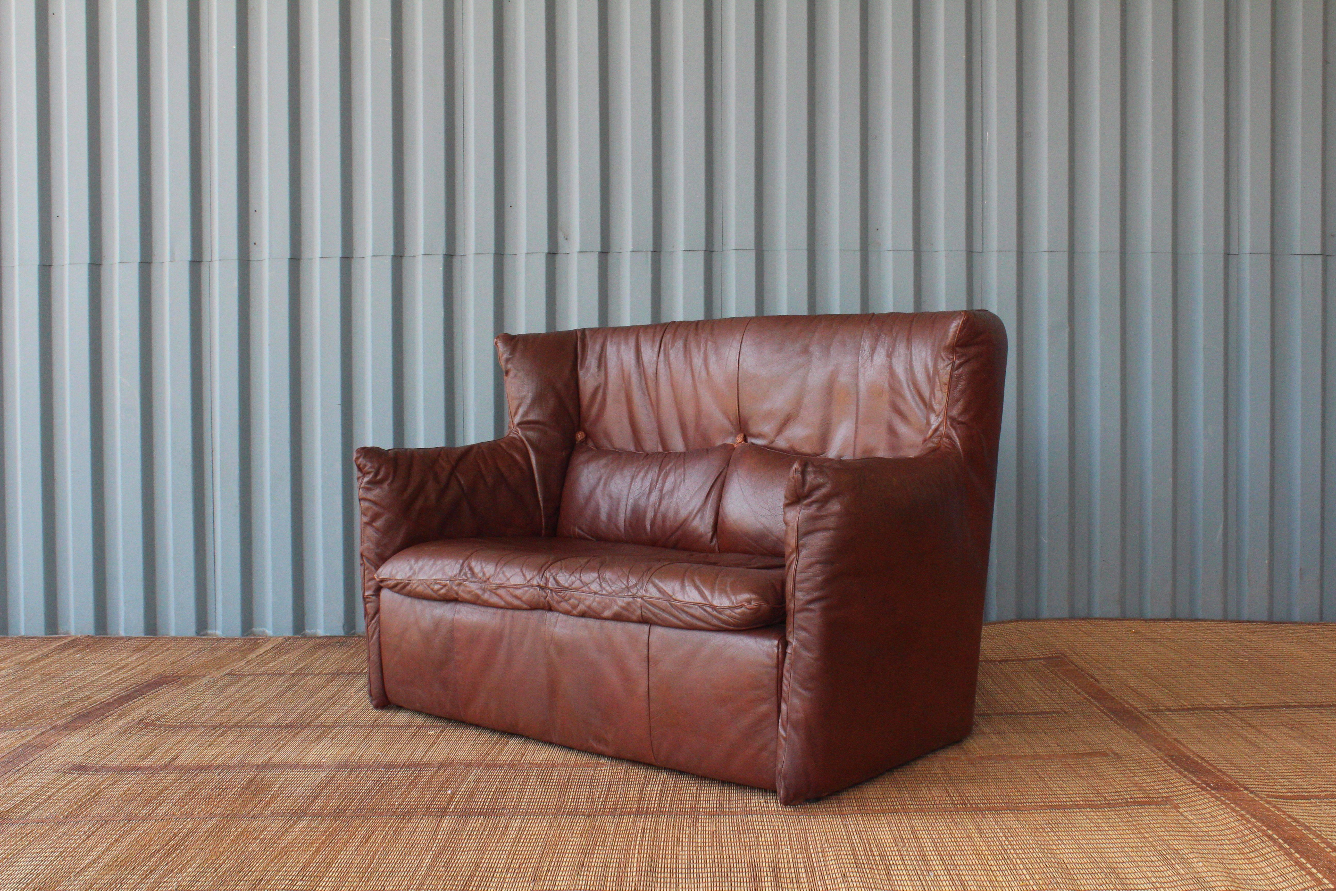 Beautiful leather loveseat designed by Gerard van den Berg for Montis, Netherlands. The leather has been aged exceptionally and was professionally reconditioned.
  