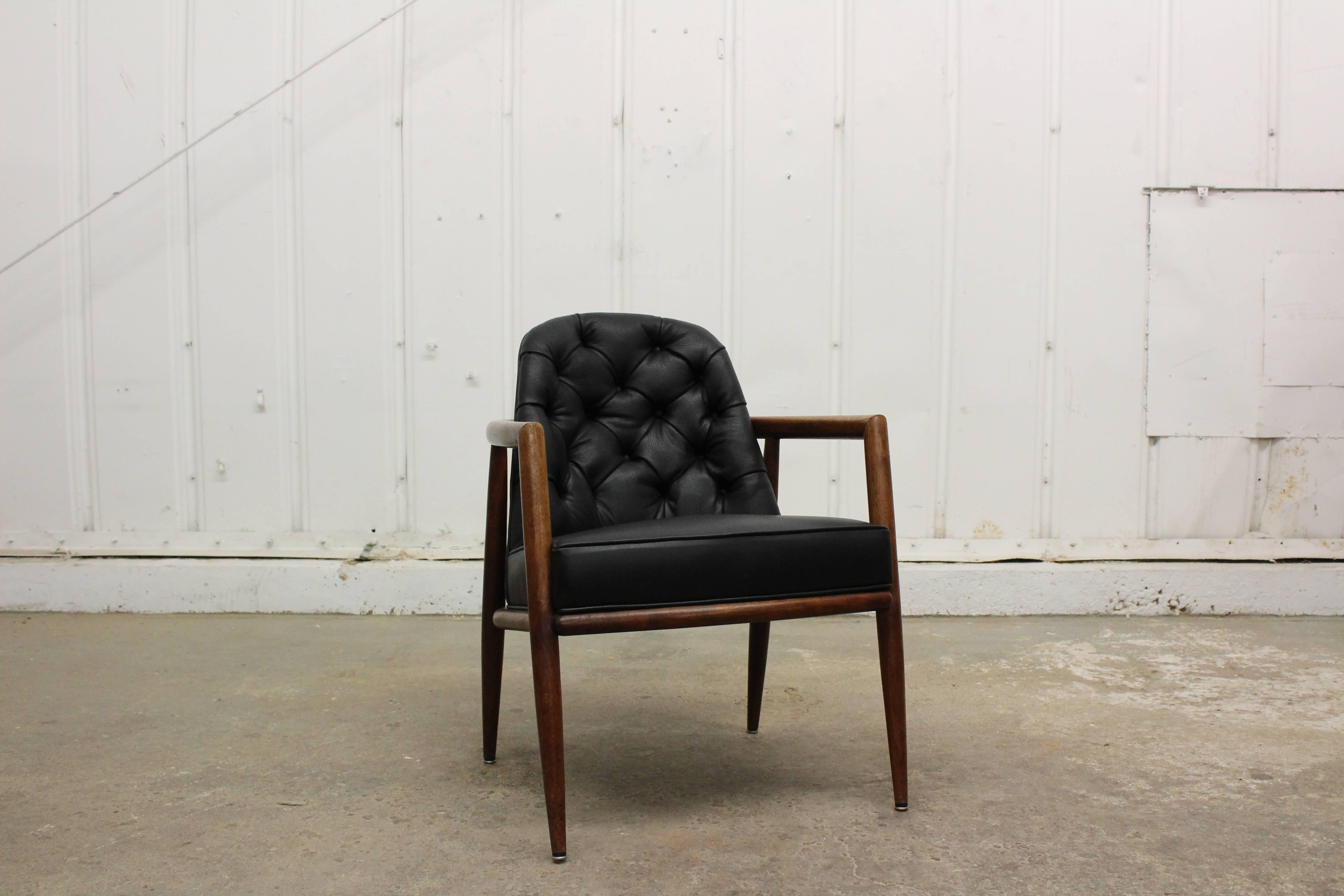 Walnut armchair with all new tufted leather, designed by T.H. Robsjohn-Gibbings.