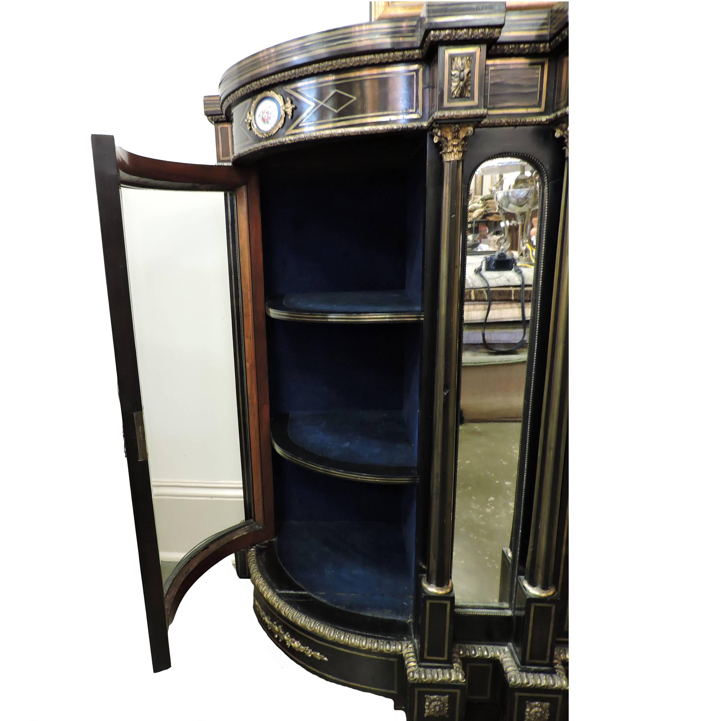 This beautiful French Louis XIV style black commode has its original bronze inlay boulle work with gold finish. This piece is complete with four hand-painted Sevres porcelain plaques in amazing condition. It features glass incased display cabinets