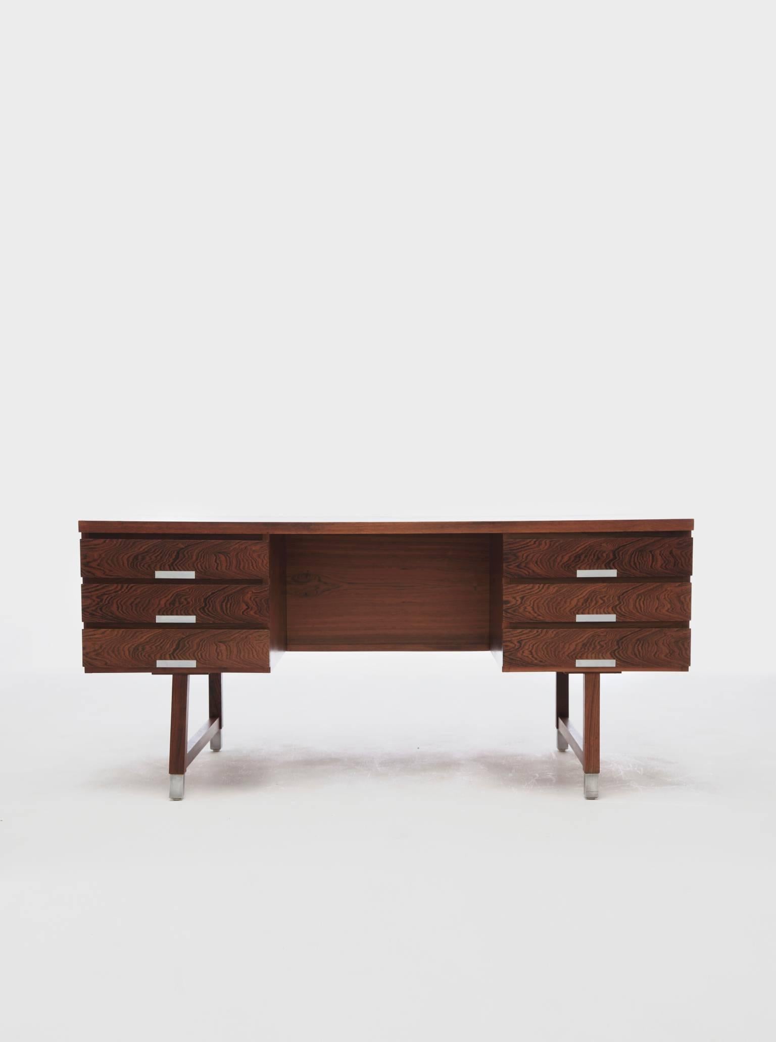 Mid-Century rosewood writing desk by Kai Kristiansen, 1960s, Denmark. Front with six drawers, reverse side with shelves. Aluminium handles and shoes. In great original condition, some shading to top. Ships worldwide.

