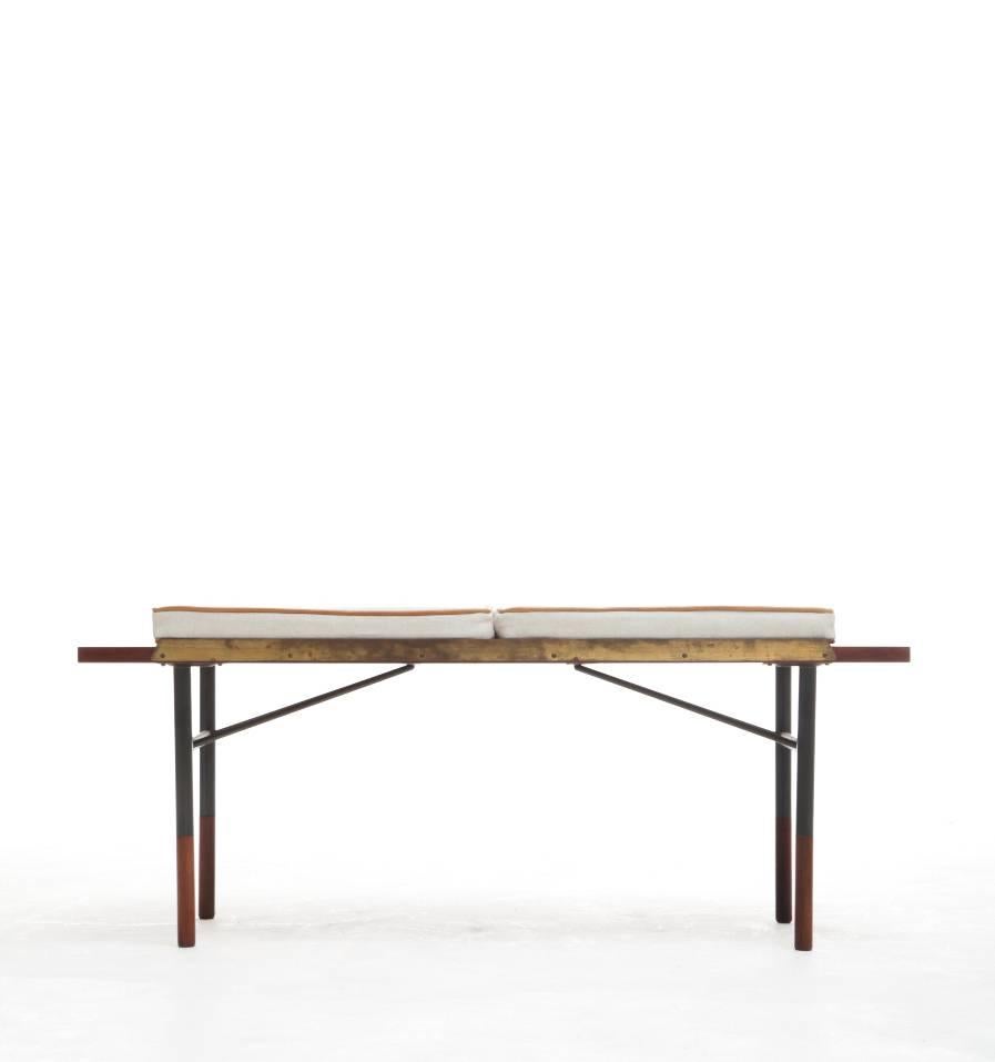 A rare Finn Juhl rosewood table/ bench with cushions.  Frame of steel with raised brass edges. Rosewood top and rosewood capped shoes. Leather piped cushions.  Usable as bench or table.  Designed by Finn Juhl 1953, made by Bovirke, Denmark. Model BO