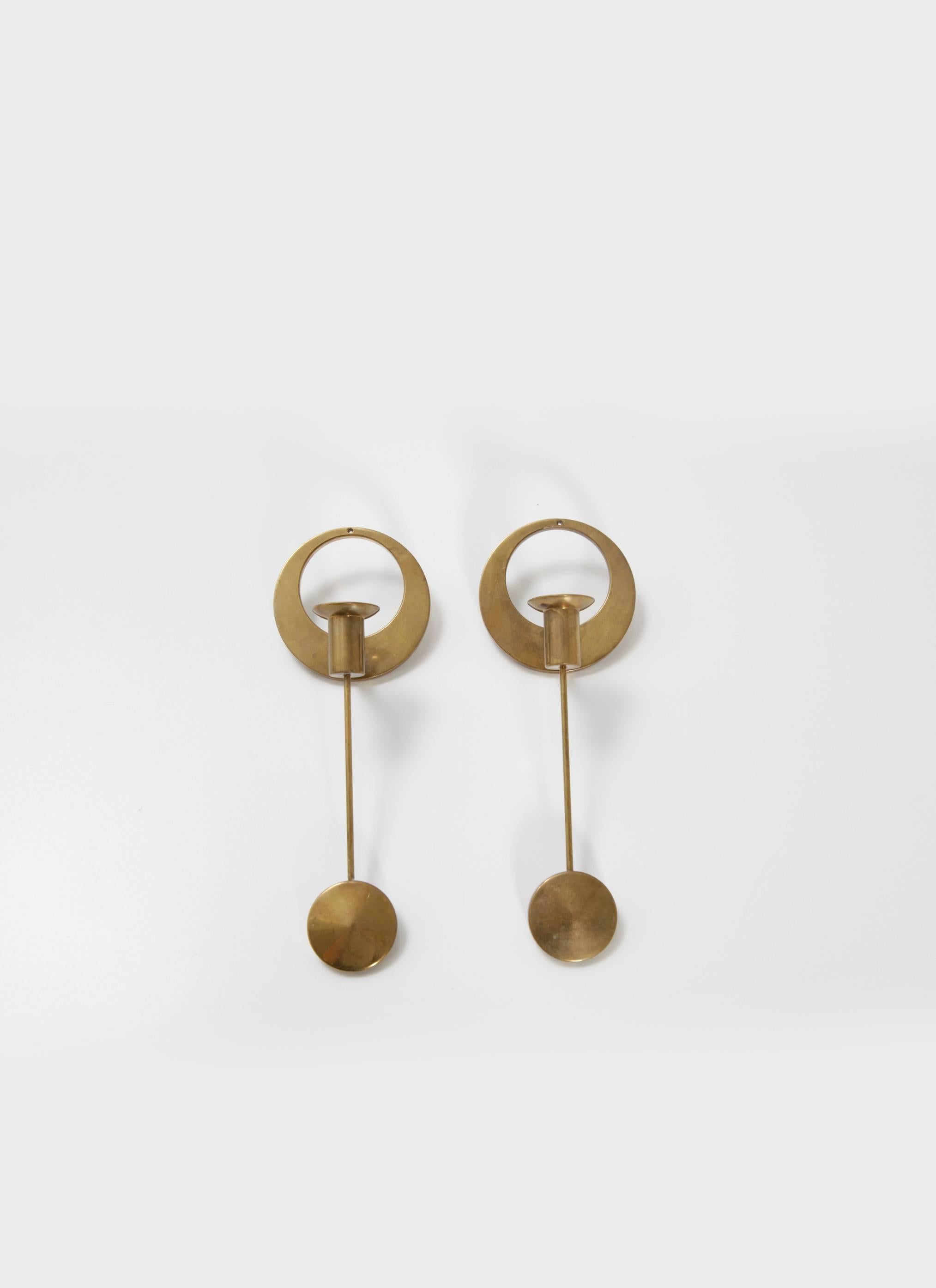A pair of elegant Mid-Century brass wall-mounted candleholders, by Artur Pe Kolbäck. In good vintage condition with a nice natural patina. The price is for the pair.  Ships worldwide.