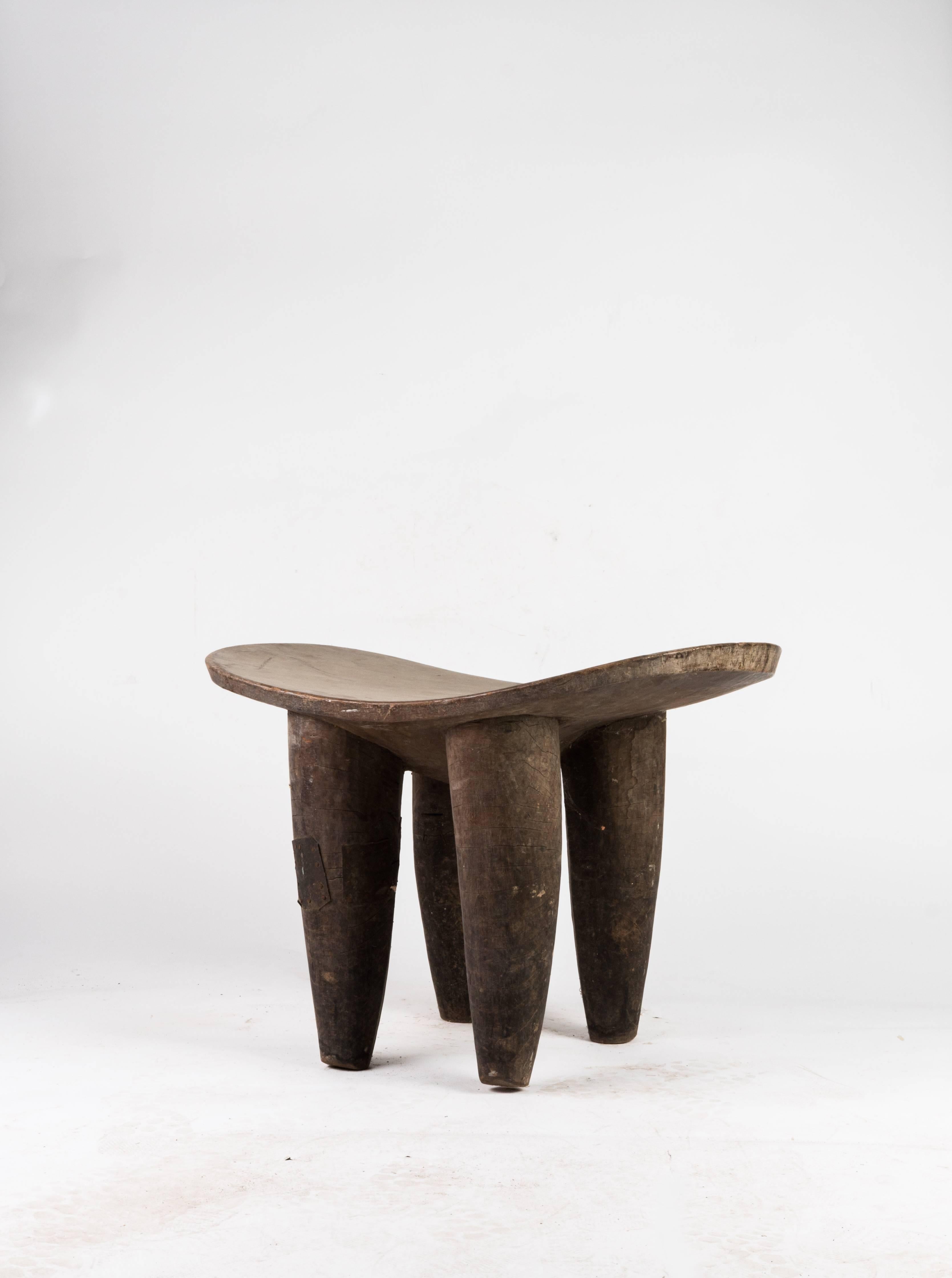 An incredible large sculptural Senufo stool. Handmade by the Senufo tribe, Cote d'Ivoire, Africa. Functional as a stool or table. Wonderful aged wood with natural patina. Ships worldwide.
