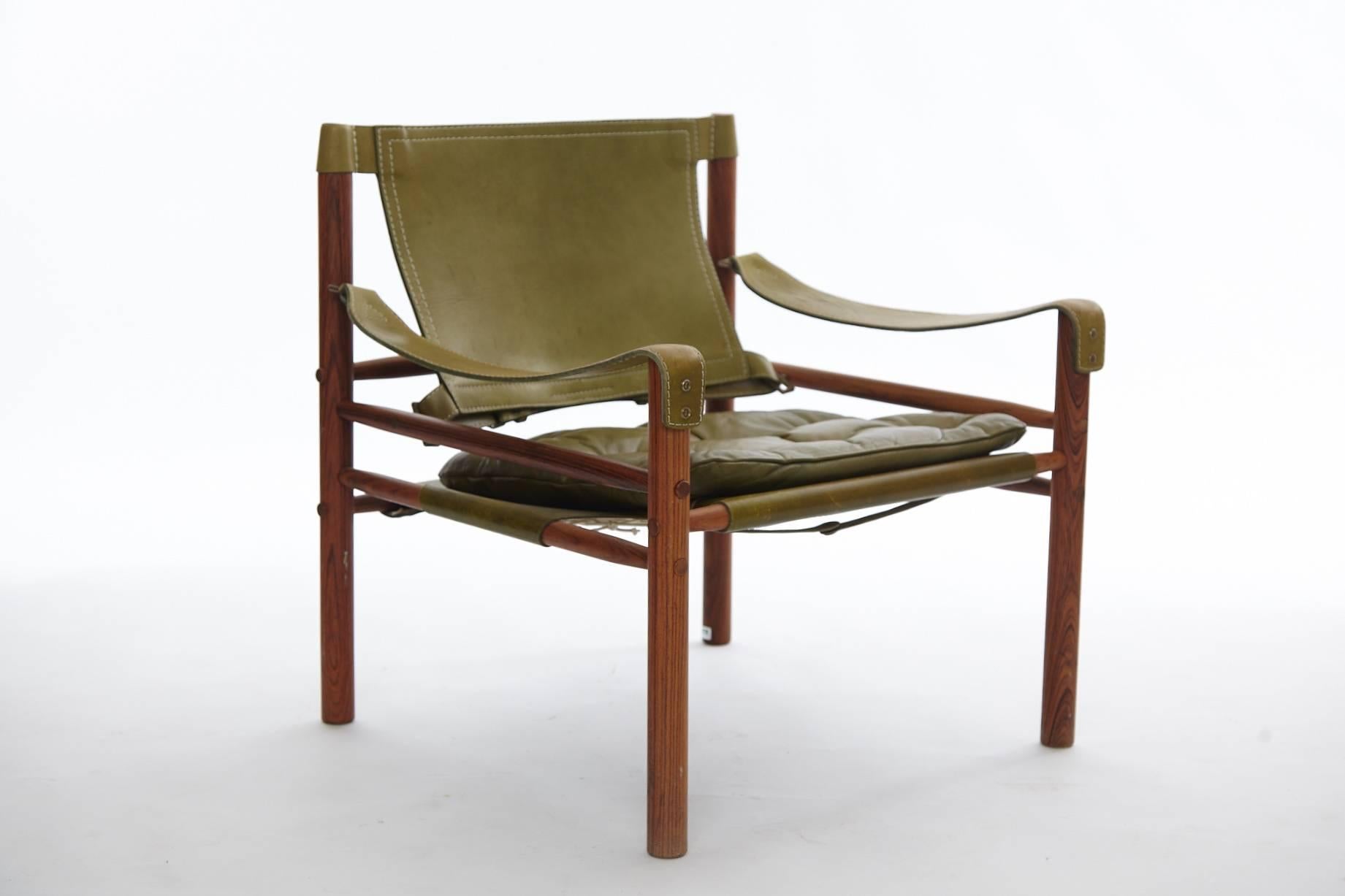 Arne Norell safari chair, green leather and rosewood, Sweden, 1970s.