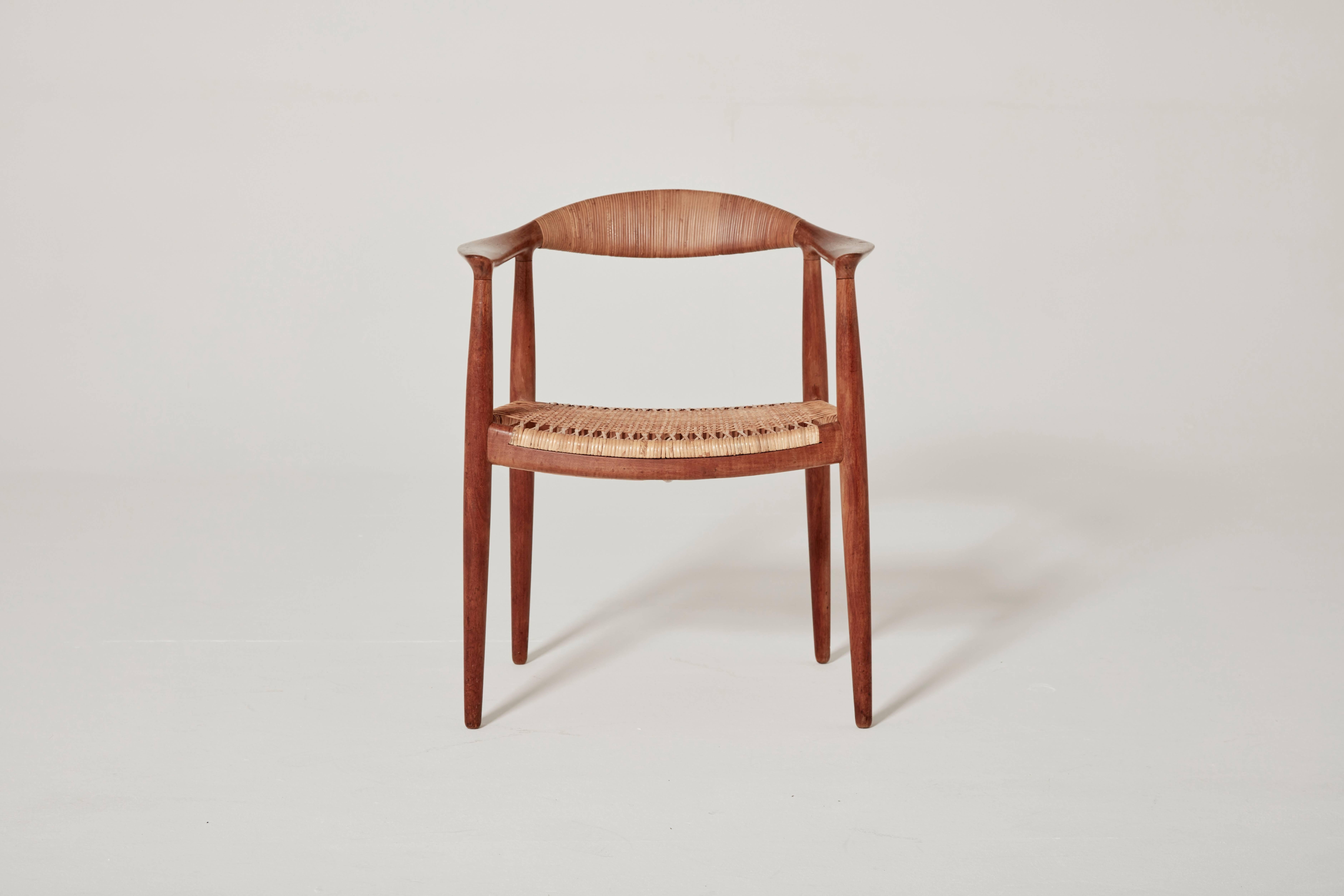 Hans Wegner's iconic 'The Chair', designed in 1949, model JH 501, made by Johannes Hansen, Denmark.  This is the earliest version in mahogany with cane seat and backrest.  Branded with makers mark.  Ships worldwide - please contact us for options.
