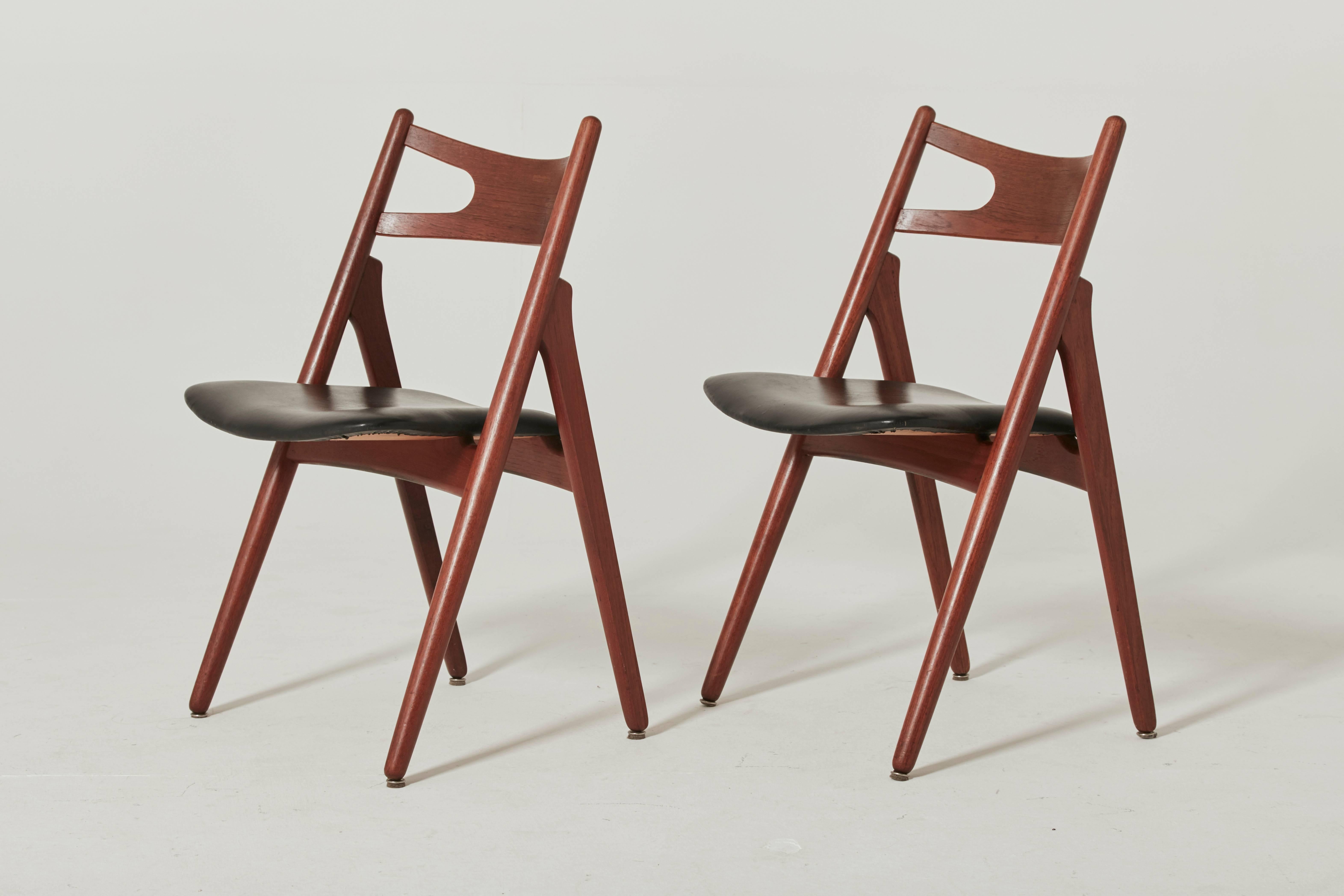 Set of six Hans Wegner CH-29 sawbuck dining chairs, designed in 1951, and made by Carl Hansen, Denmark, in the 1960s. Teak frames.   We offer a recovering service for these chairs if you would prefer a different seat cover.   Ships worldwide -