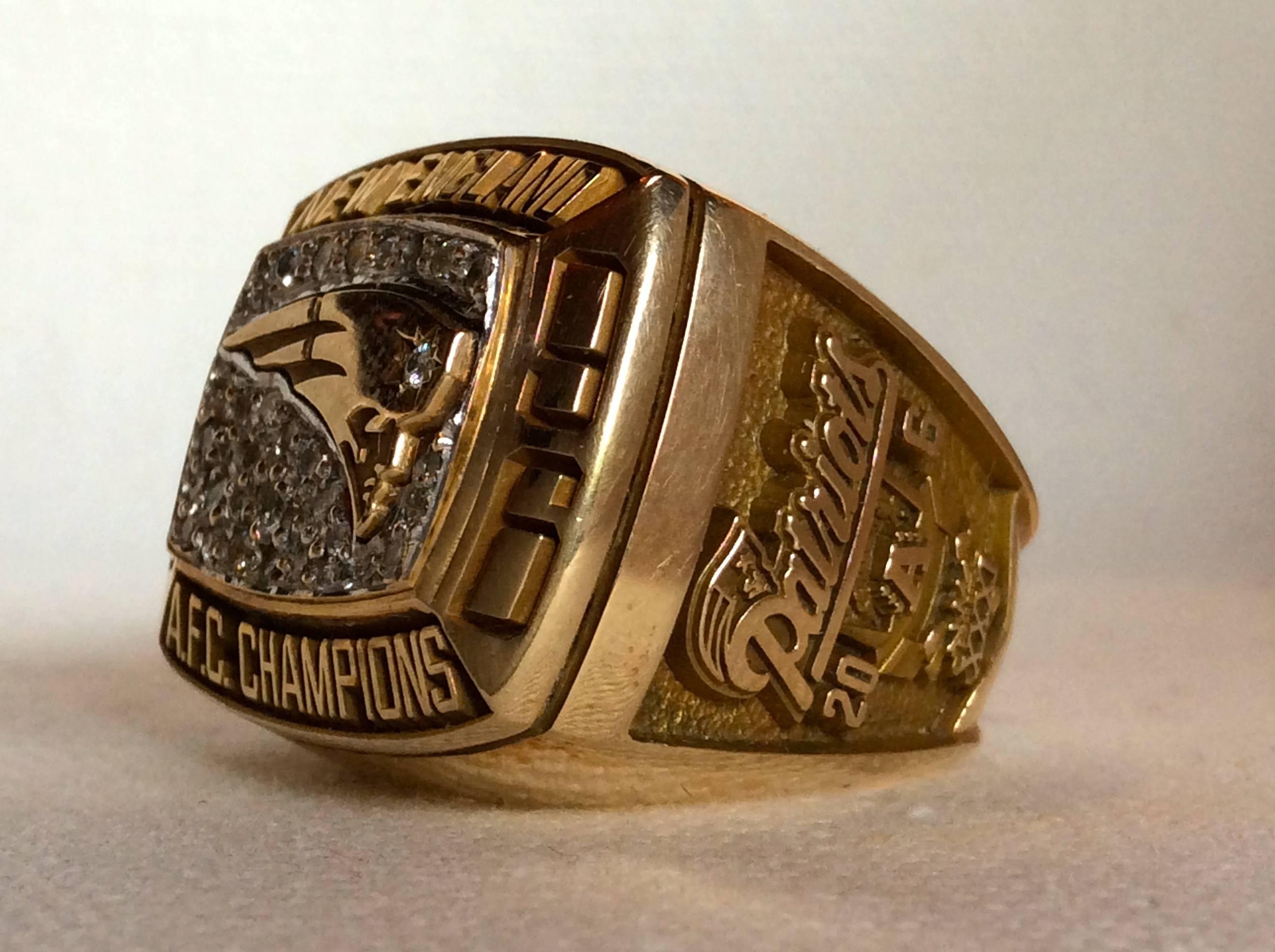 1996 New England patriots AFC Championship Ring. Ring is manufactured by Jostens, made of 10-karat gold with all real, genuine high grade diamonds. This ring is an original issue, authentic staff members ring, same as players received. Guaranteed