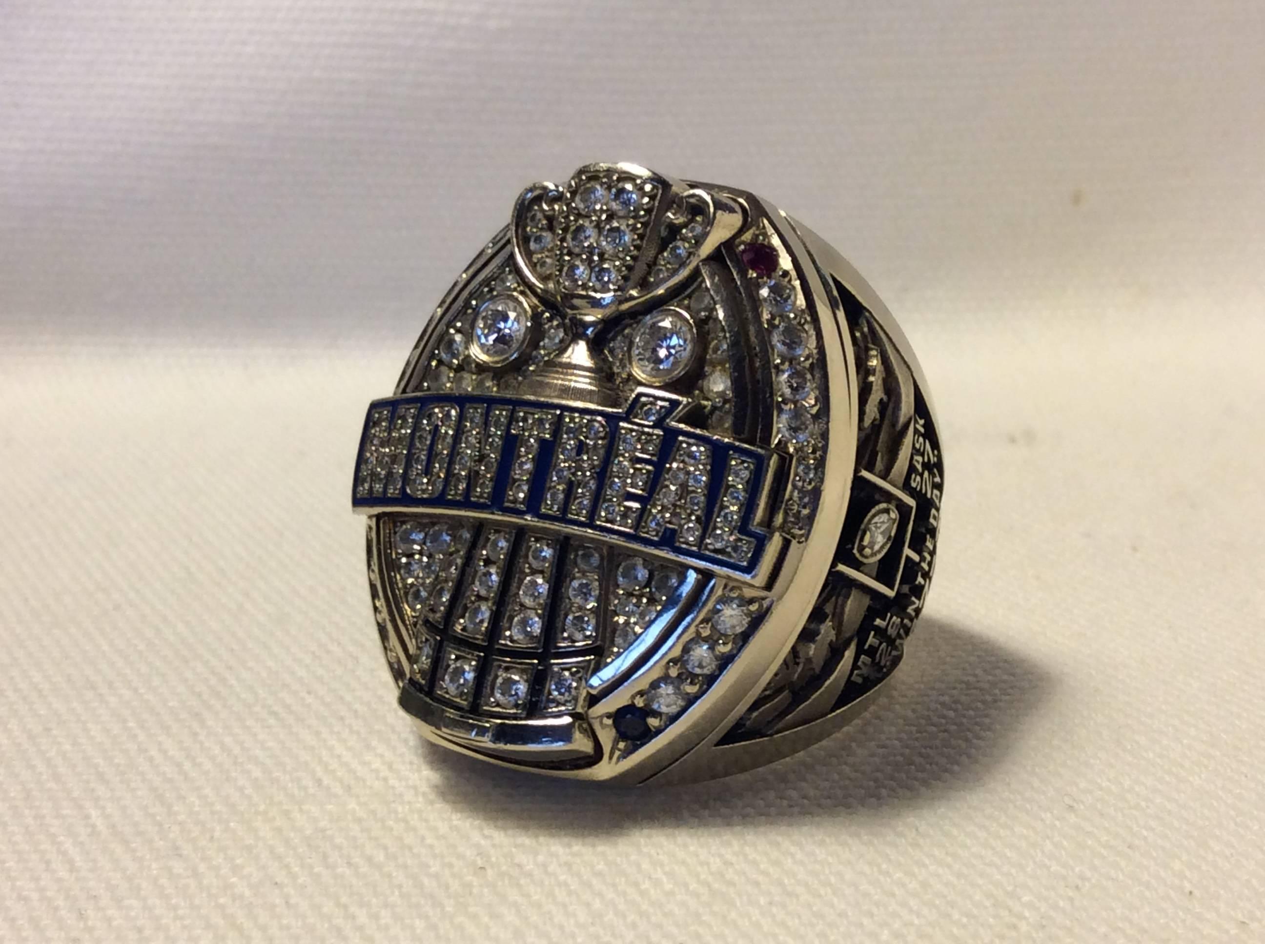 2009 Montreal Alouettes CFL Grey cup Players Championship ring. Made of 10-karat gold with all real high grade diamonds, Rubies, and Sapphires. Size 13.5-14, weighs a massive 80.5 grams makes this one of the largest championship rings ever produced.