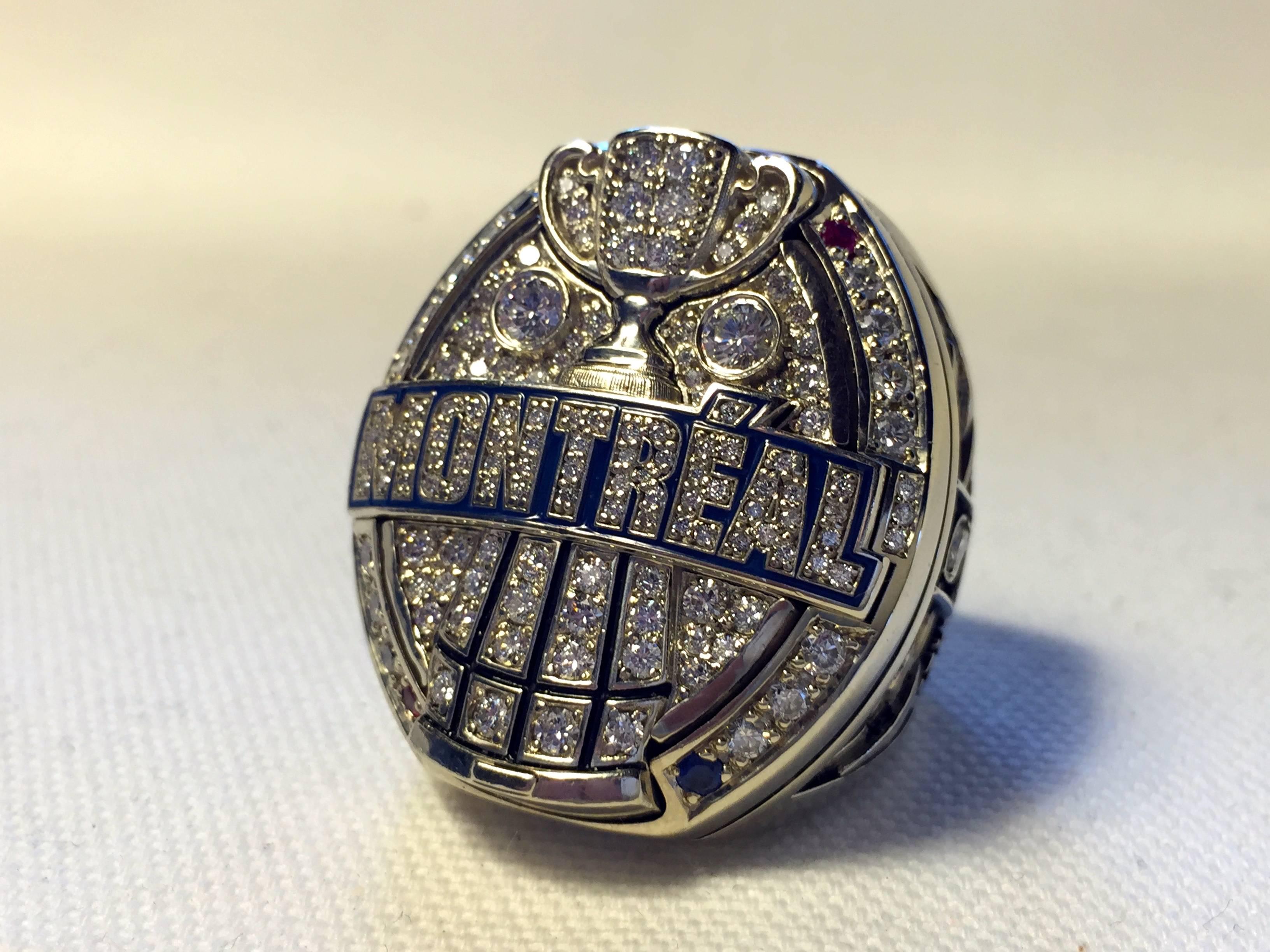 2009 Montreal Alouettes CFL Grey cup Players Championship ring. Made of 10-karat gold with all real high grade diamonds, Rubies, and Sapphires. Size 11.5, weighs a massive 77.8 grams makes this one of the largest championship rings ever produced..