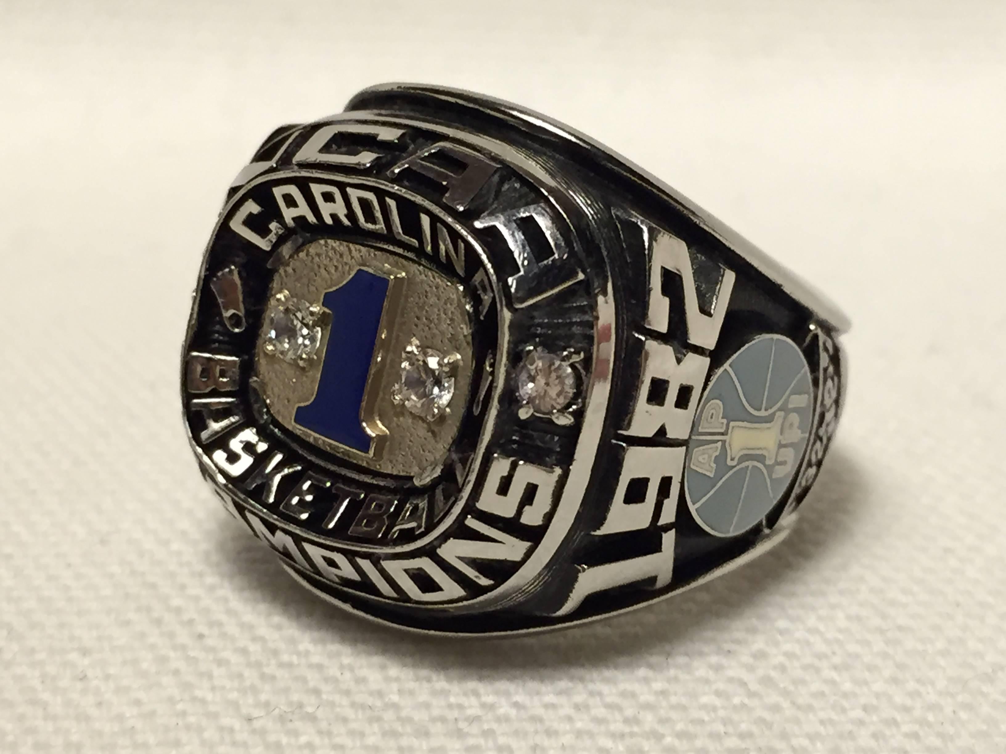 Authentic 1982 University of North Carolina basketball national championship salesman sample ring, size 10-11. Has HJ and serial number on the inside of the band, Herff Jones authenticated, guaranteed authentic.