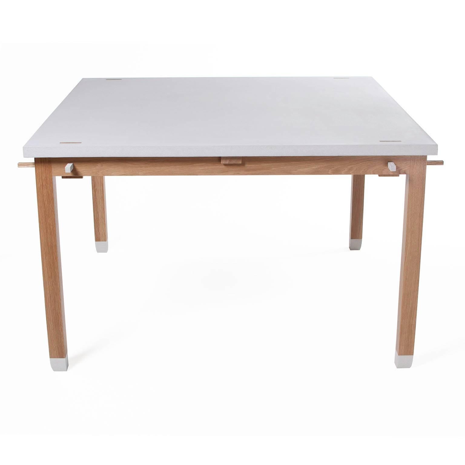 Garden table
Measures: 122, 122, 75 ( 48" square 29.5" high )
cast concrete and white oak
conversion varnish durable finish

In stunning light natural grey cast concrete and naturally decay resistant white oak, this square dining
